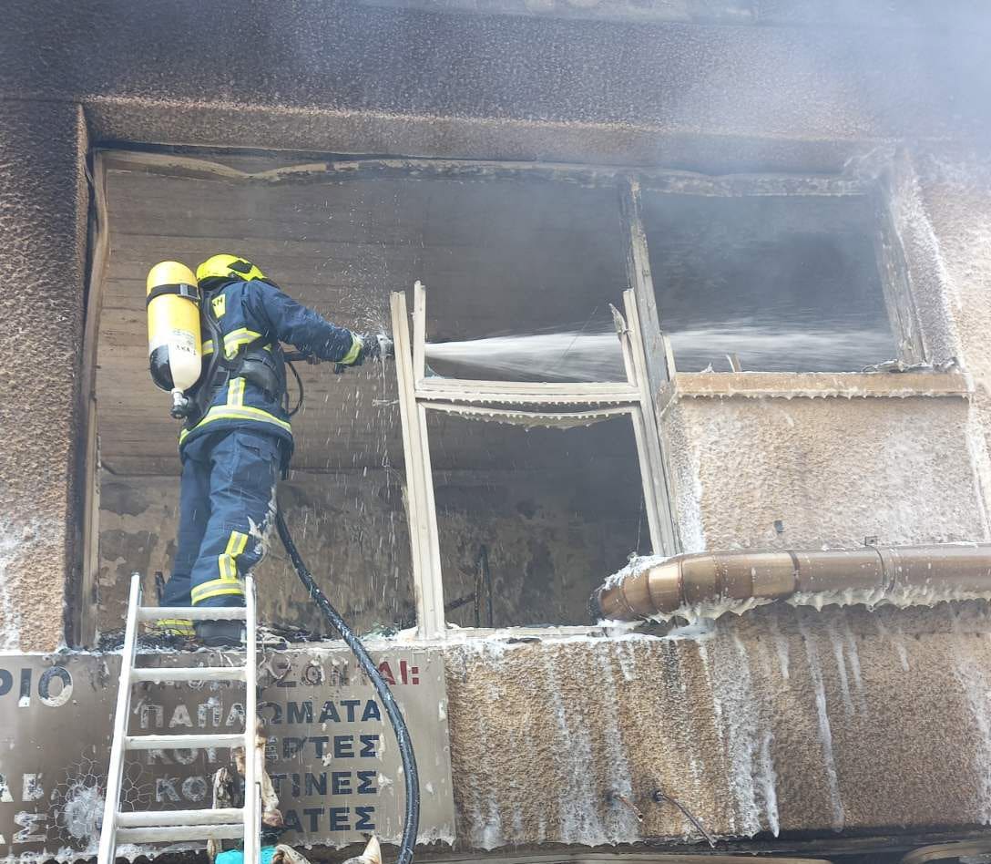 cover Larnaca dry cleaner’s damaged by fire