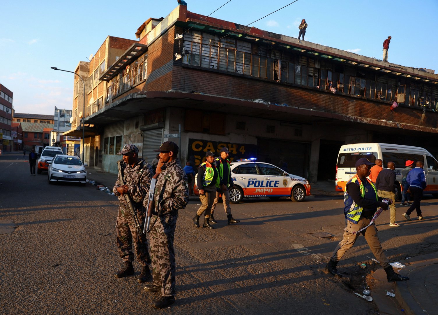 image Sniffer dogs search for clues in ashes of deadly South African fire