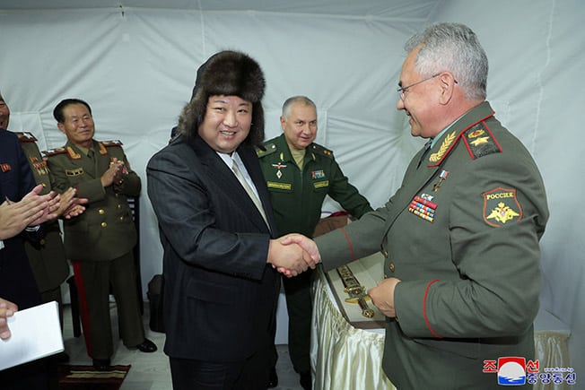 image Rifle, fur hat, drones: Kim returns with gifts from Russia
