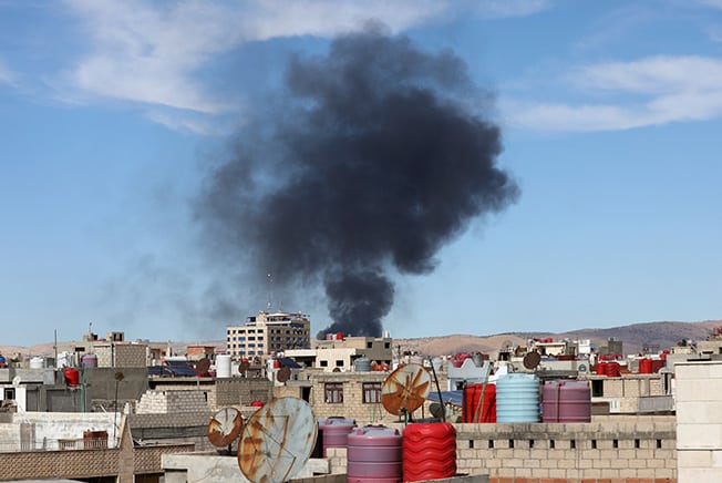 smoke rises from qamishli