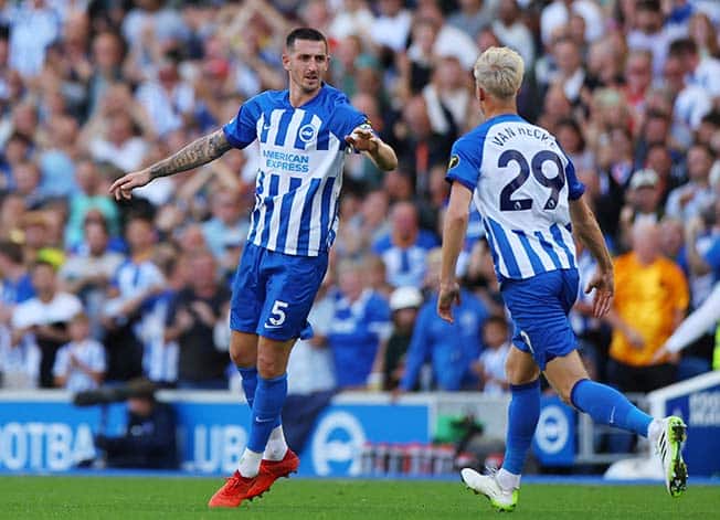 cover Dunk delivers as Brighton fight back to draw with Liverpool