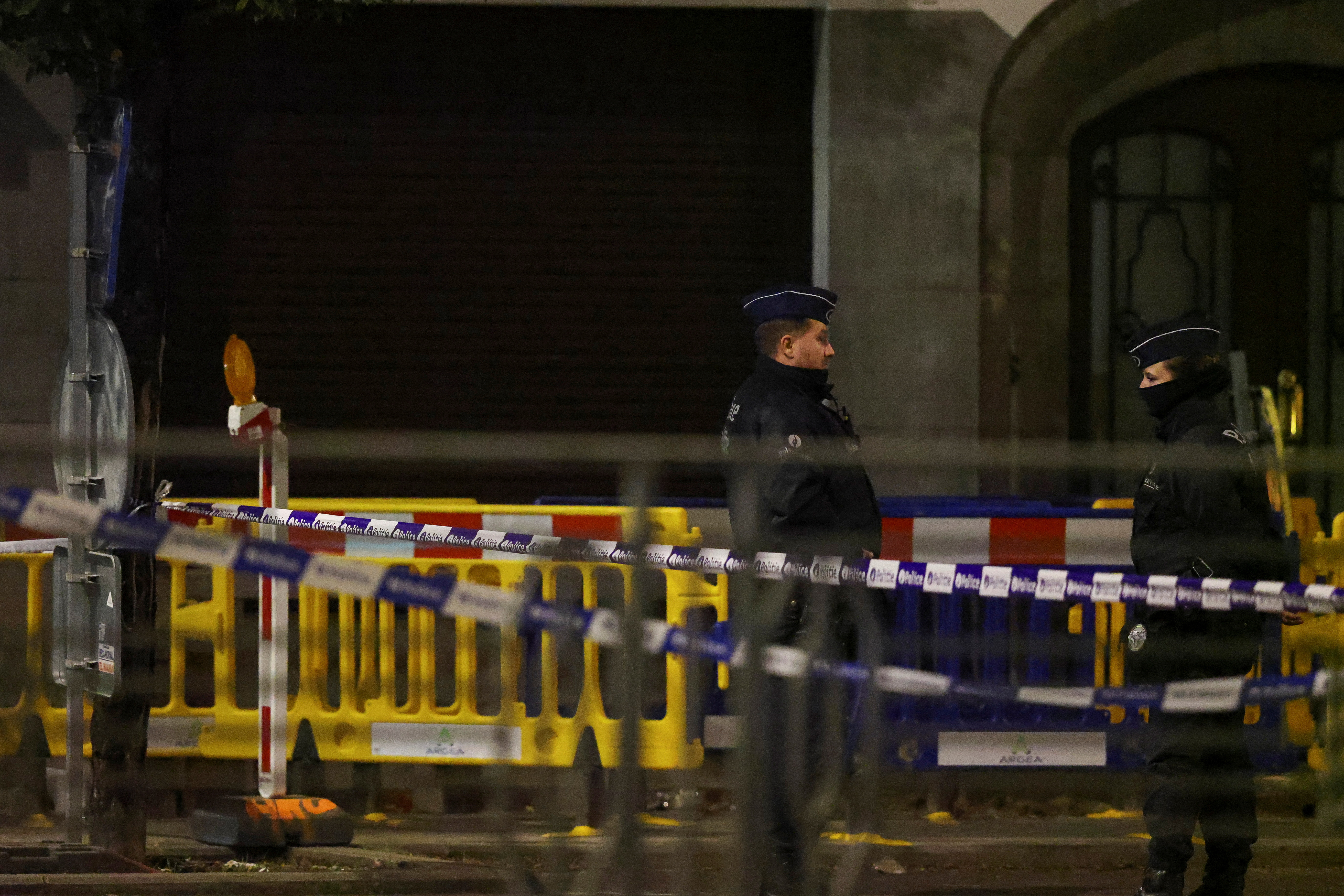 cover Belgium hunts shooter of Swedes as Brussels put on maximum alert