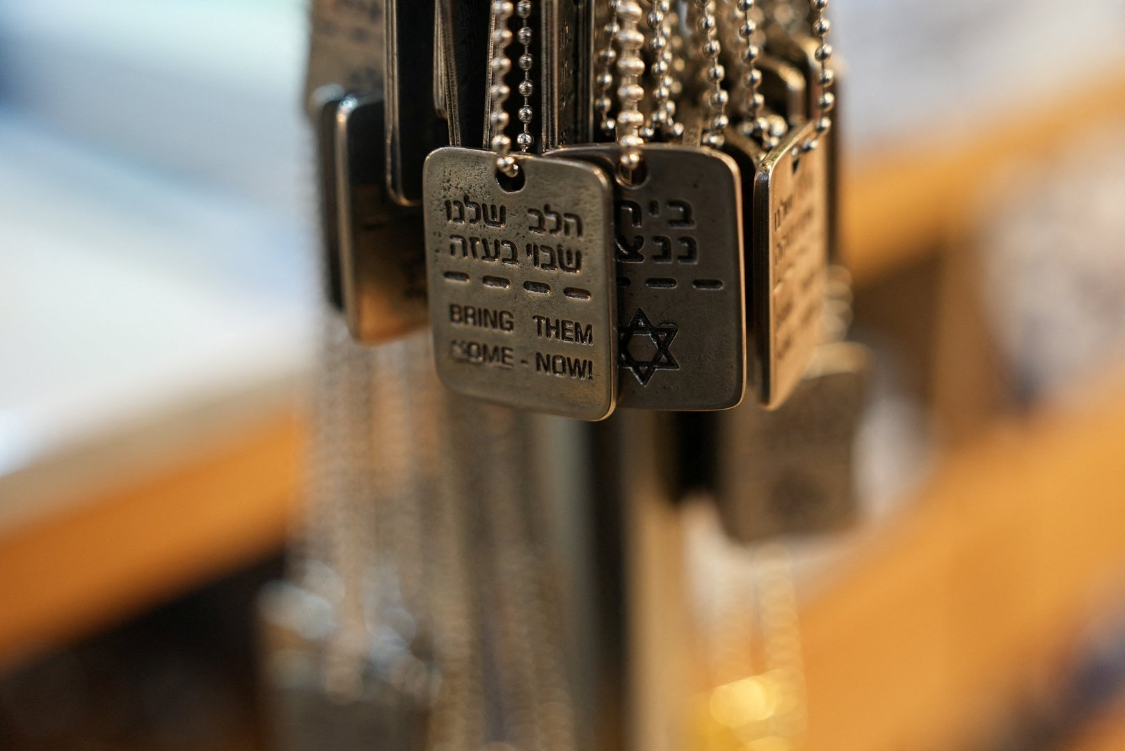 image Israelis wear dog tags in solidarity with hostages and each other