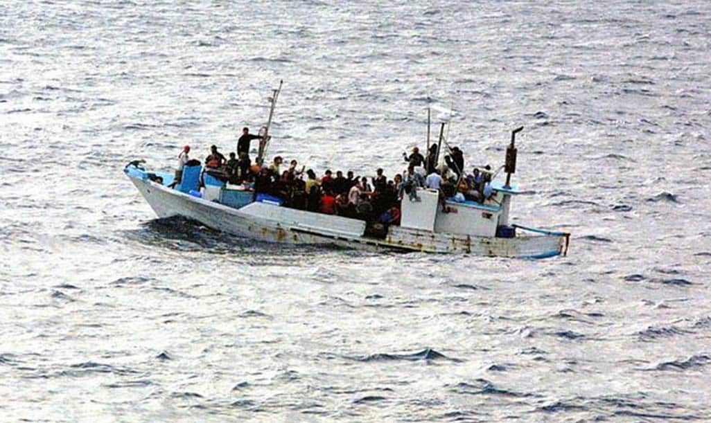 image 144 migrants found, boat drivers remanded (updated)