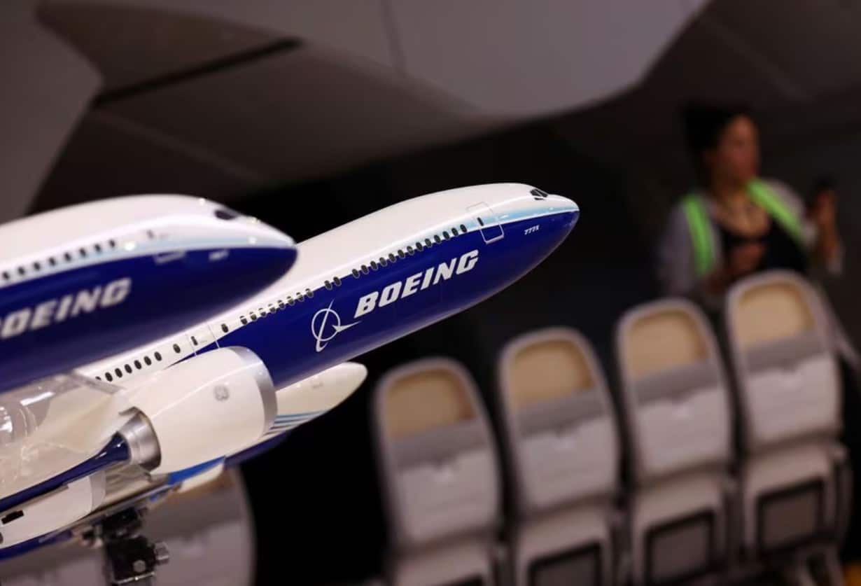 image Boeing reports first revenue drop in 7 quarters as deliveries decline