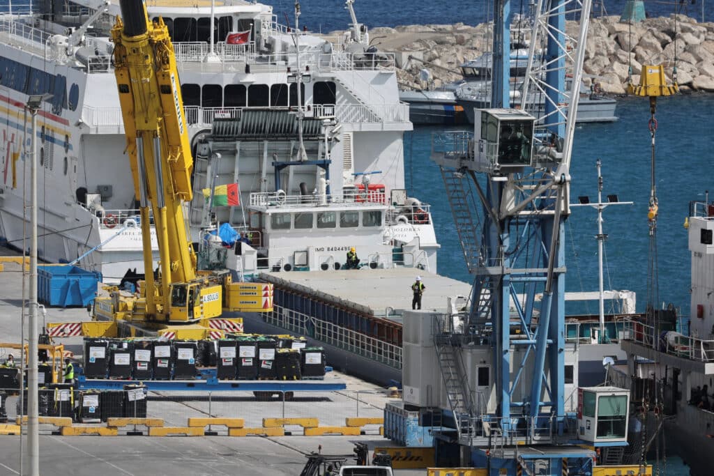 humanitarian aid for gaza is loaded on a cargo ship in the port of larnaca