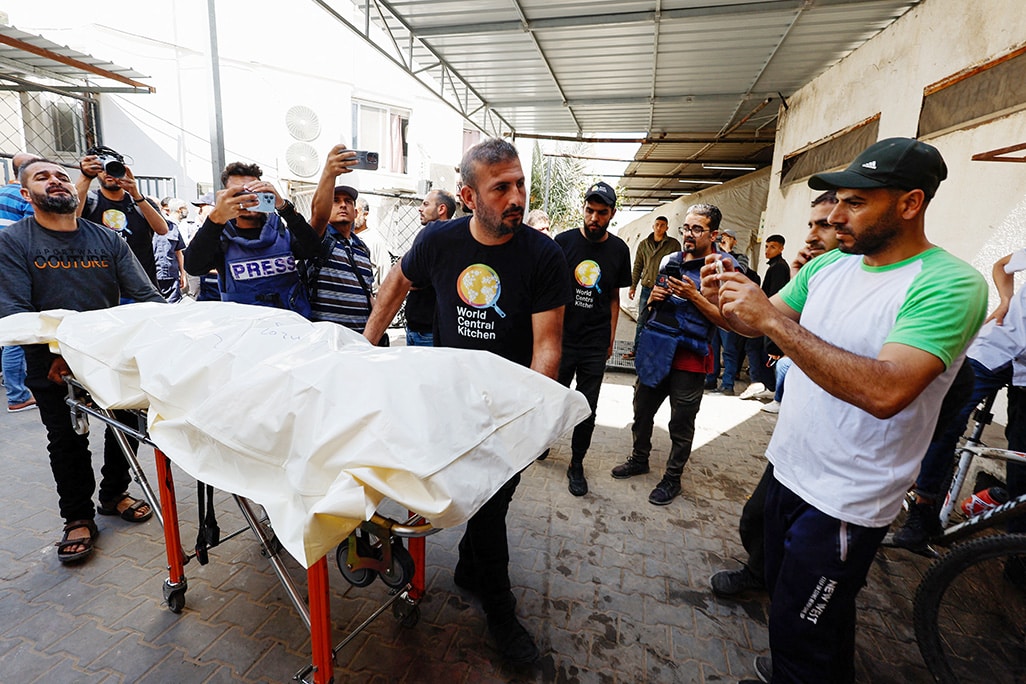 image Bodies of foreign aid workers killed in Israeli strike leave Gaza