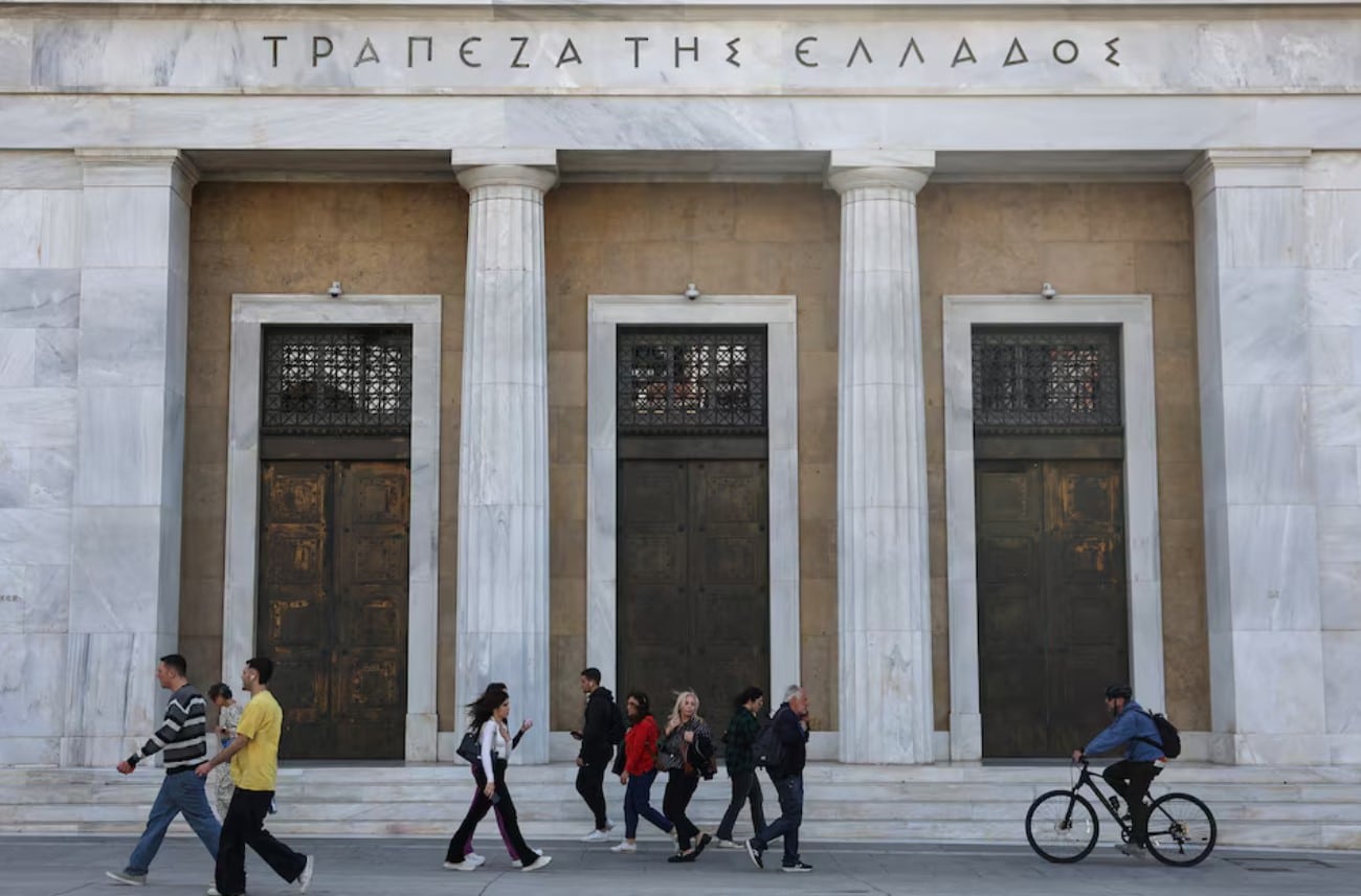 People walk in front of Bank of Greece in central Athens, Greece, April 12, 2024. REUTERS/Louisa Gouliamaki/File Photo ---------- greece athens greek cenbank