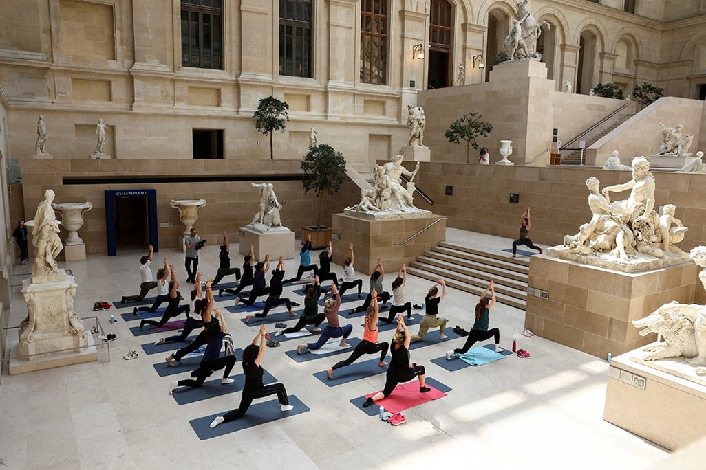 image Parisians warm up for Olympics with workouts in Louvre