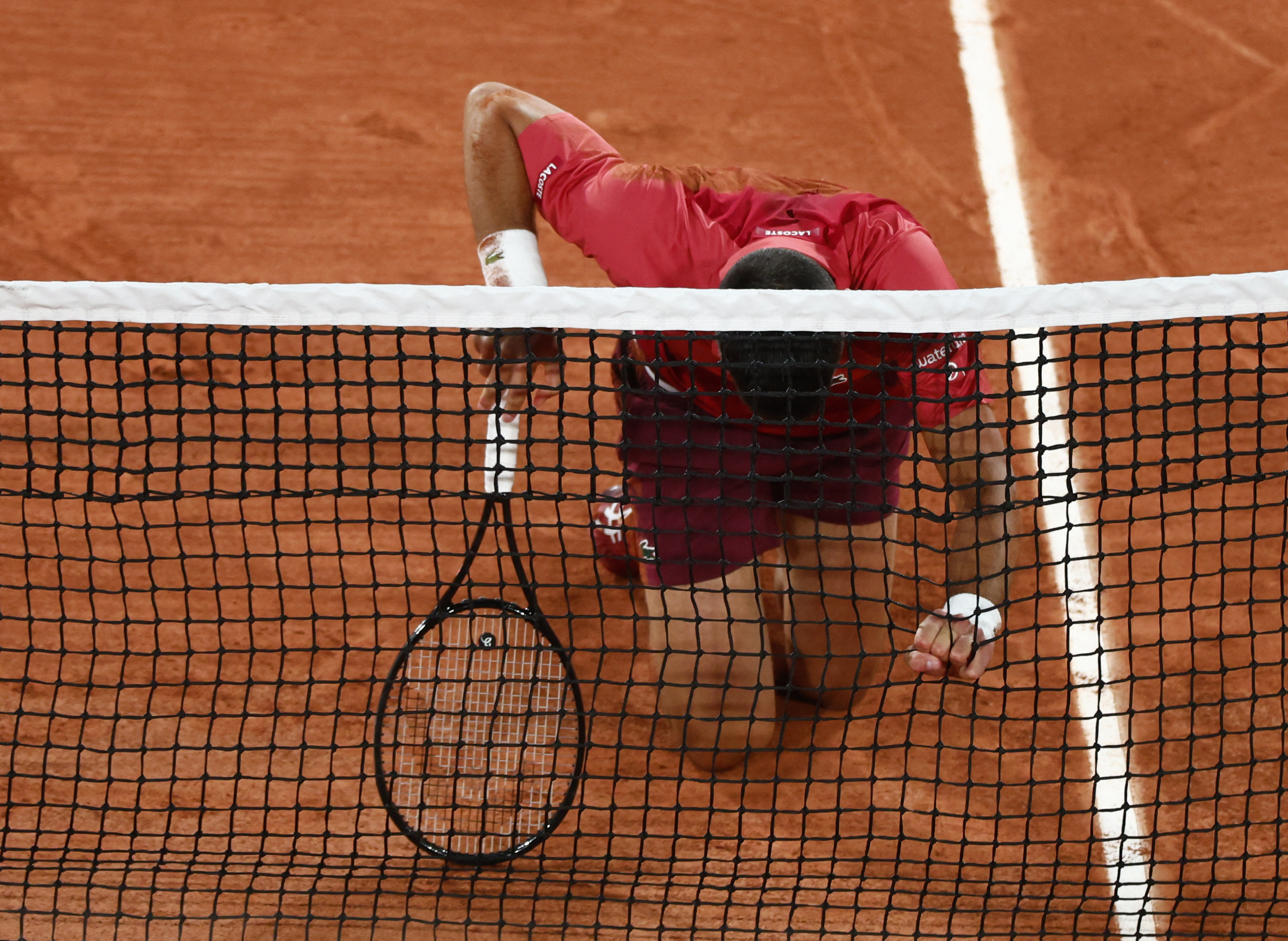 image Djokovic and Sabalenka ease through on rain-hit day at French Open