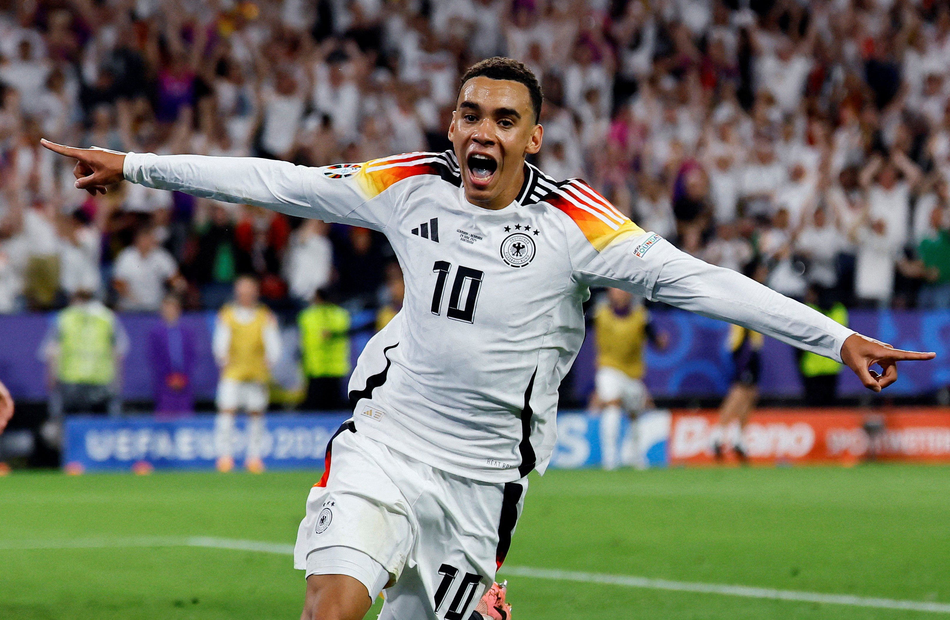 cover Germany weather storm to beat Denmark and reach quarters