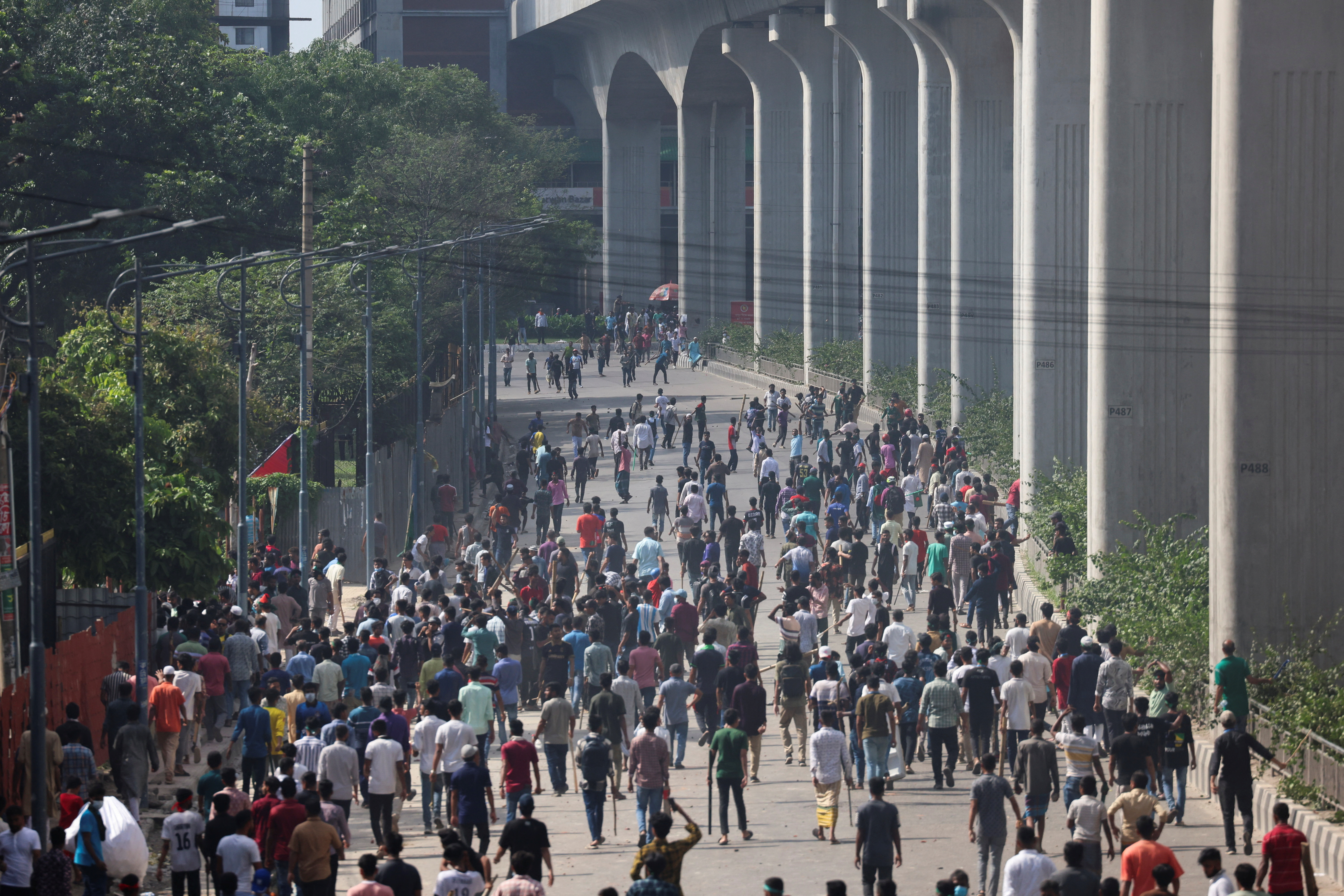 Bangladesh protesters call for march to Dhaka in defiance of curfew, at least 91 killed in protests