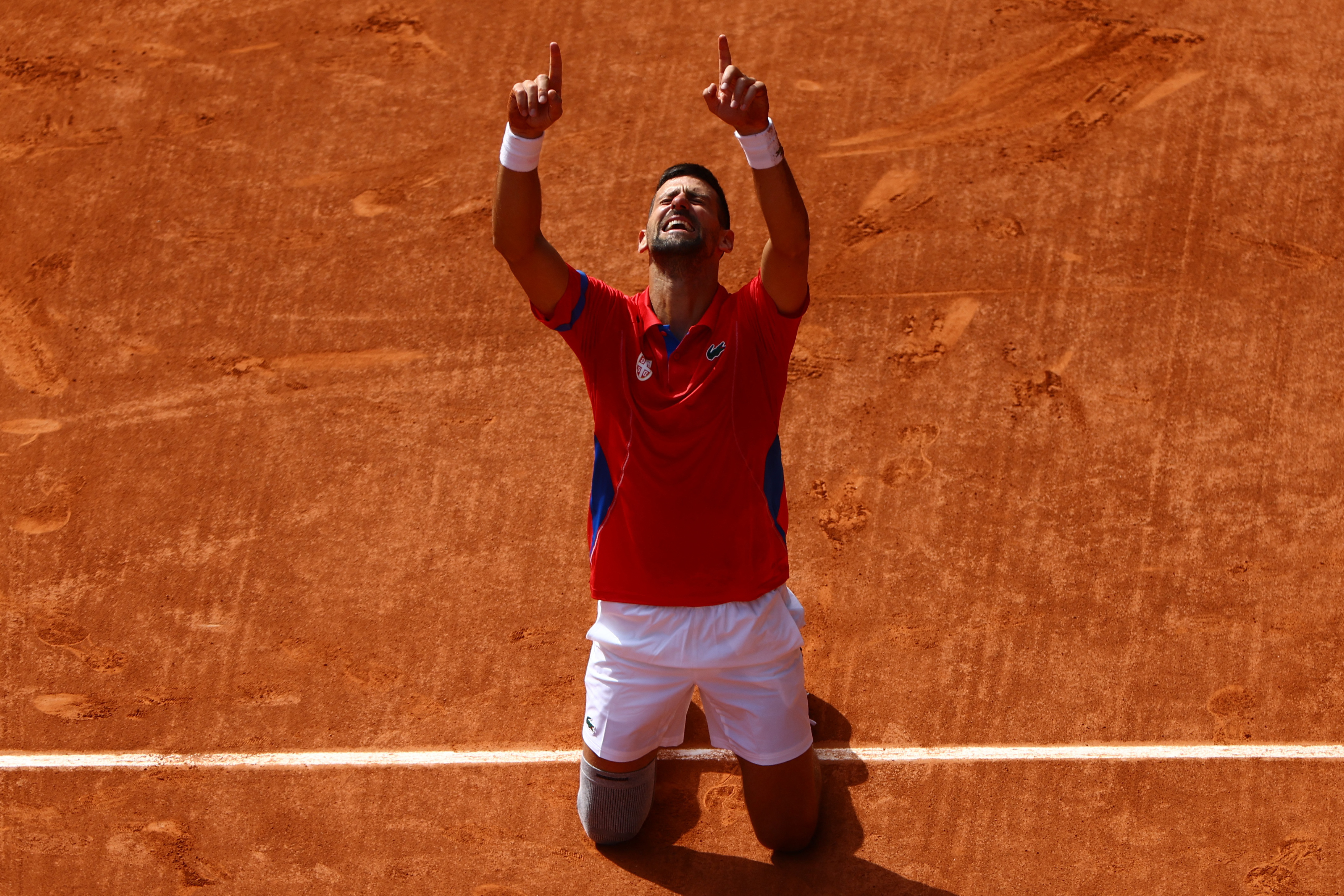 Djokovic fights off Alcaraz to finally strike gold