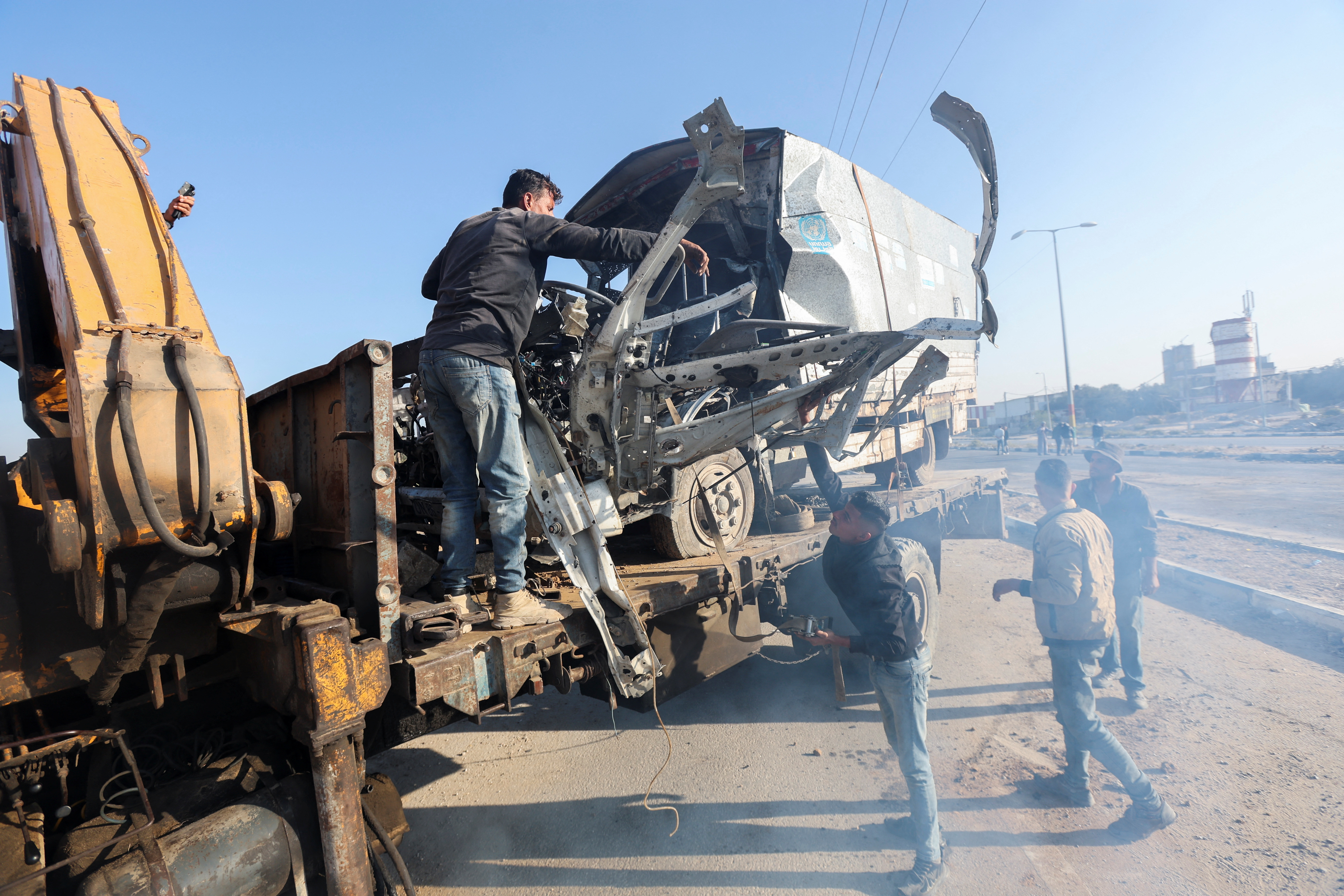 Nearly 100 food aid trucks violently looted in Gaza, UN agencies say