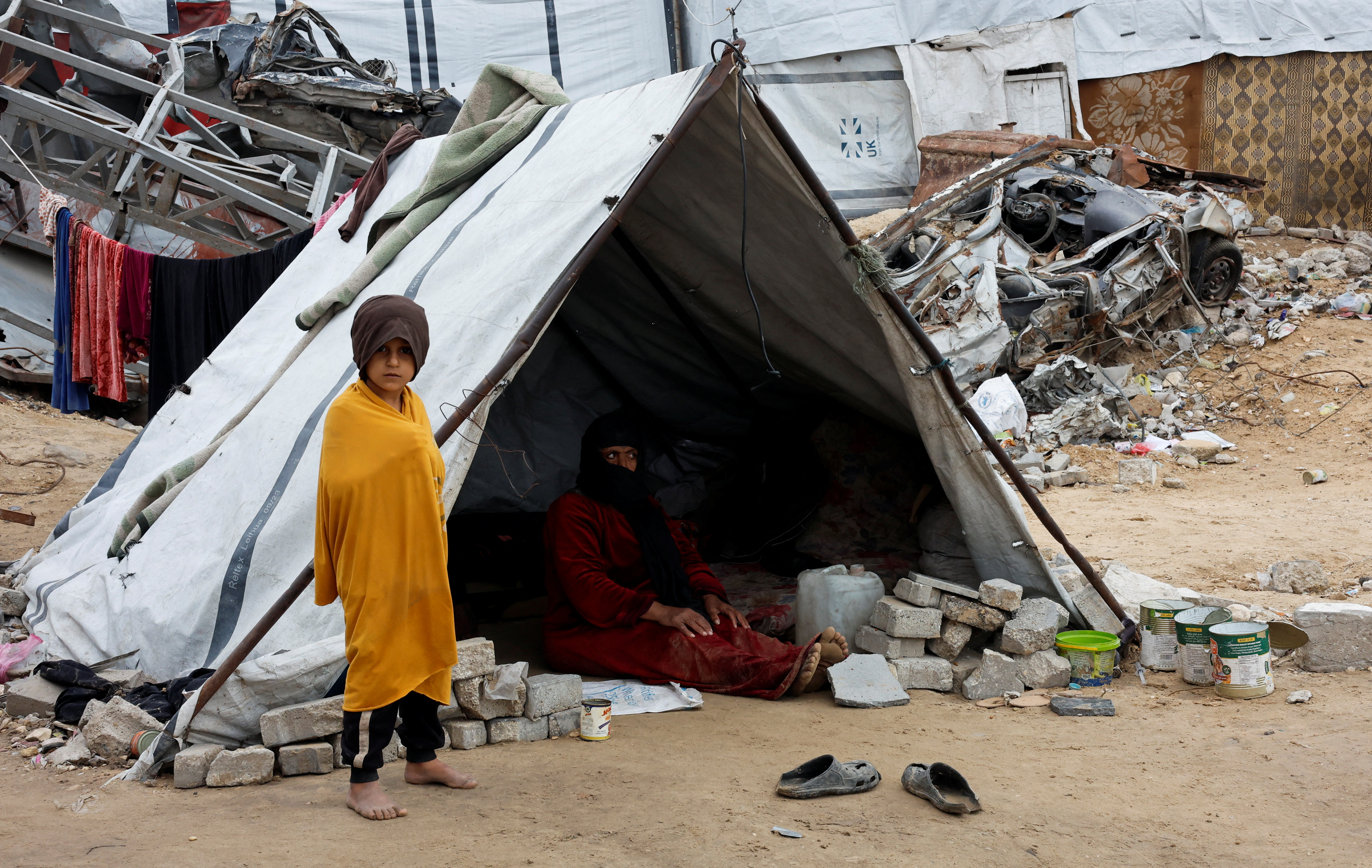 Rainstorms flood tents of Gaza’s displaced as Israel steps up strikes