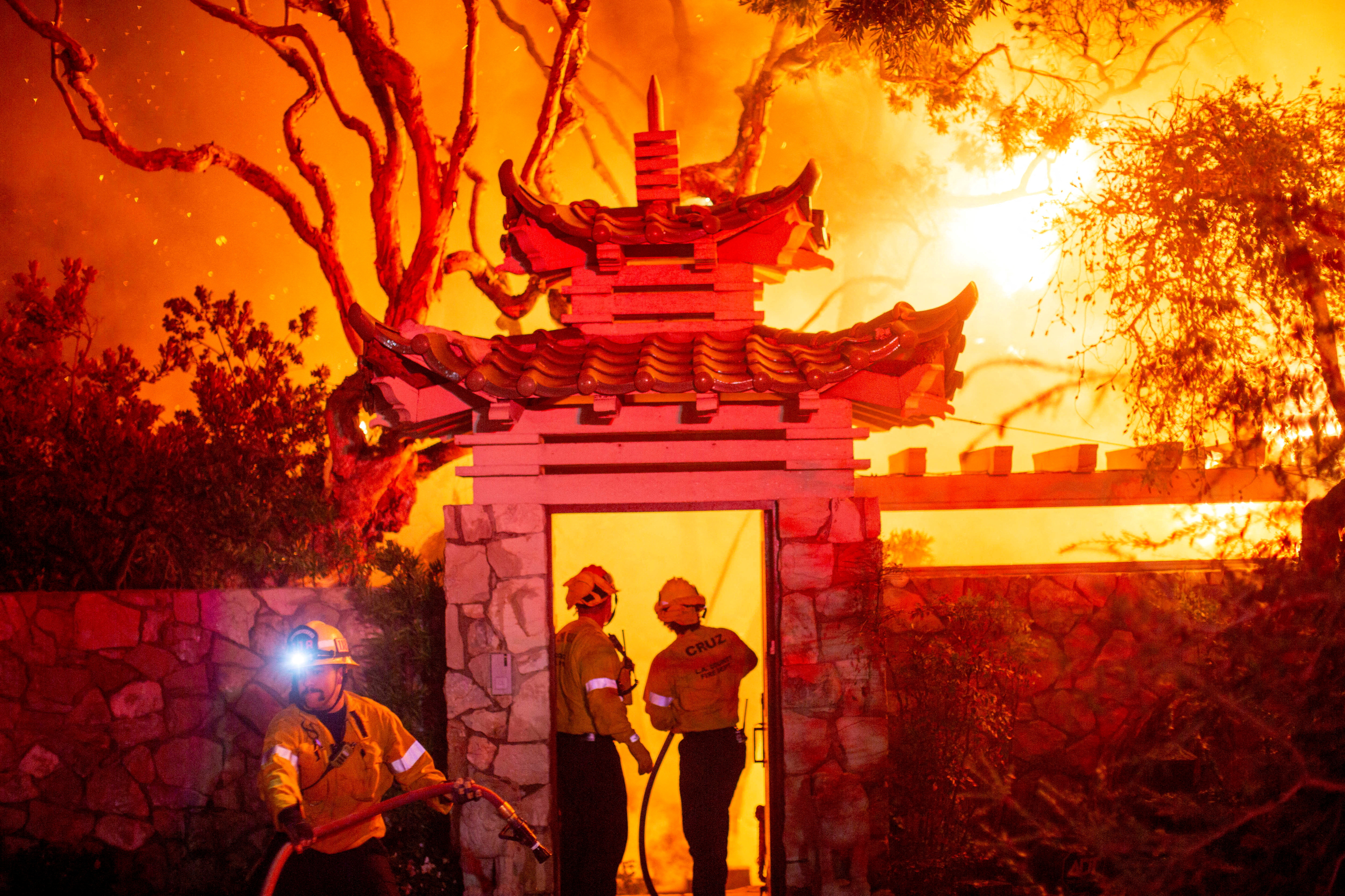 Los Angeles wildfires spread to Hollywood as 100,000 ordered to evacuate, at least five killed