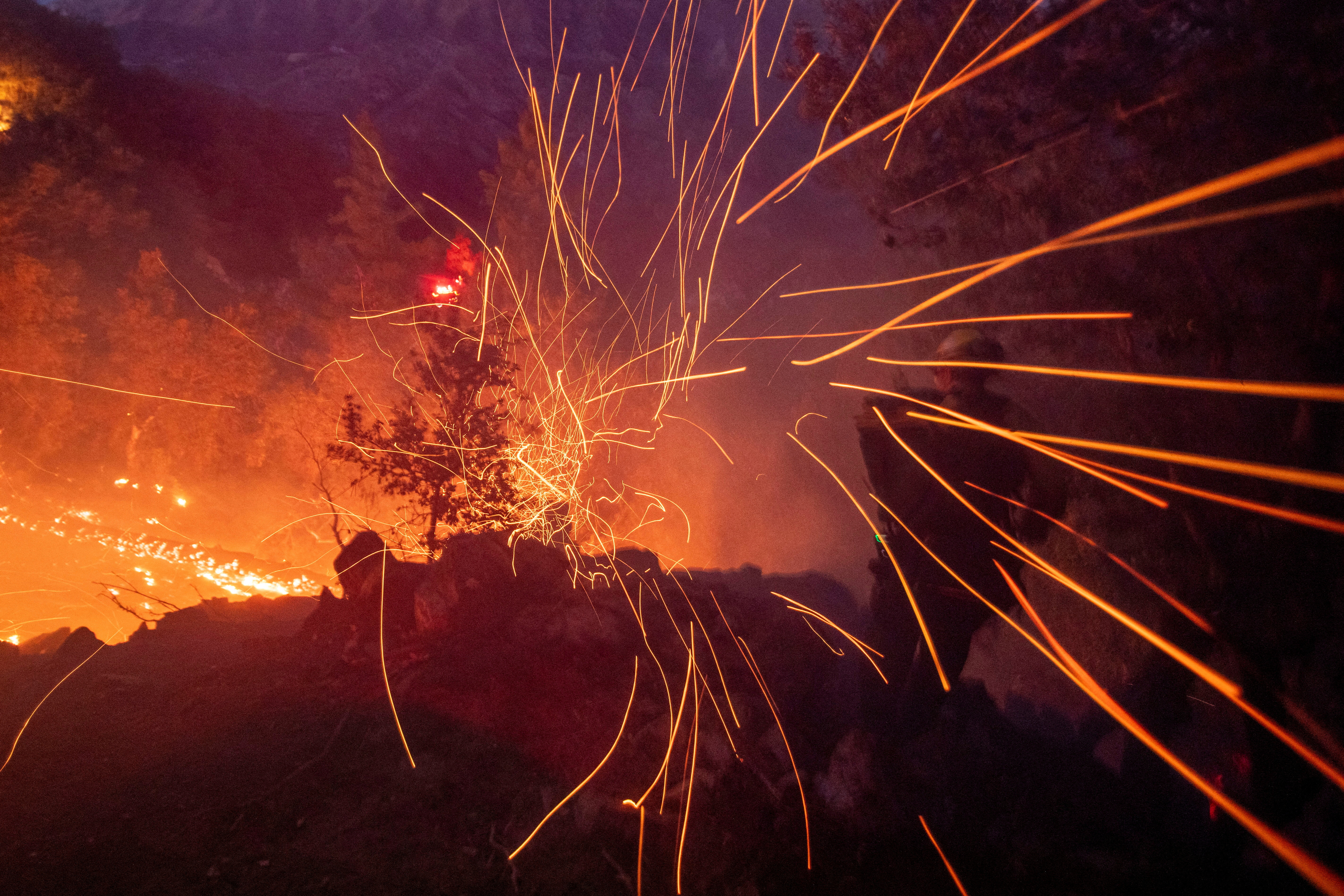 Los Angeles wildfires devour thousands of homes even as fierce winds ease