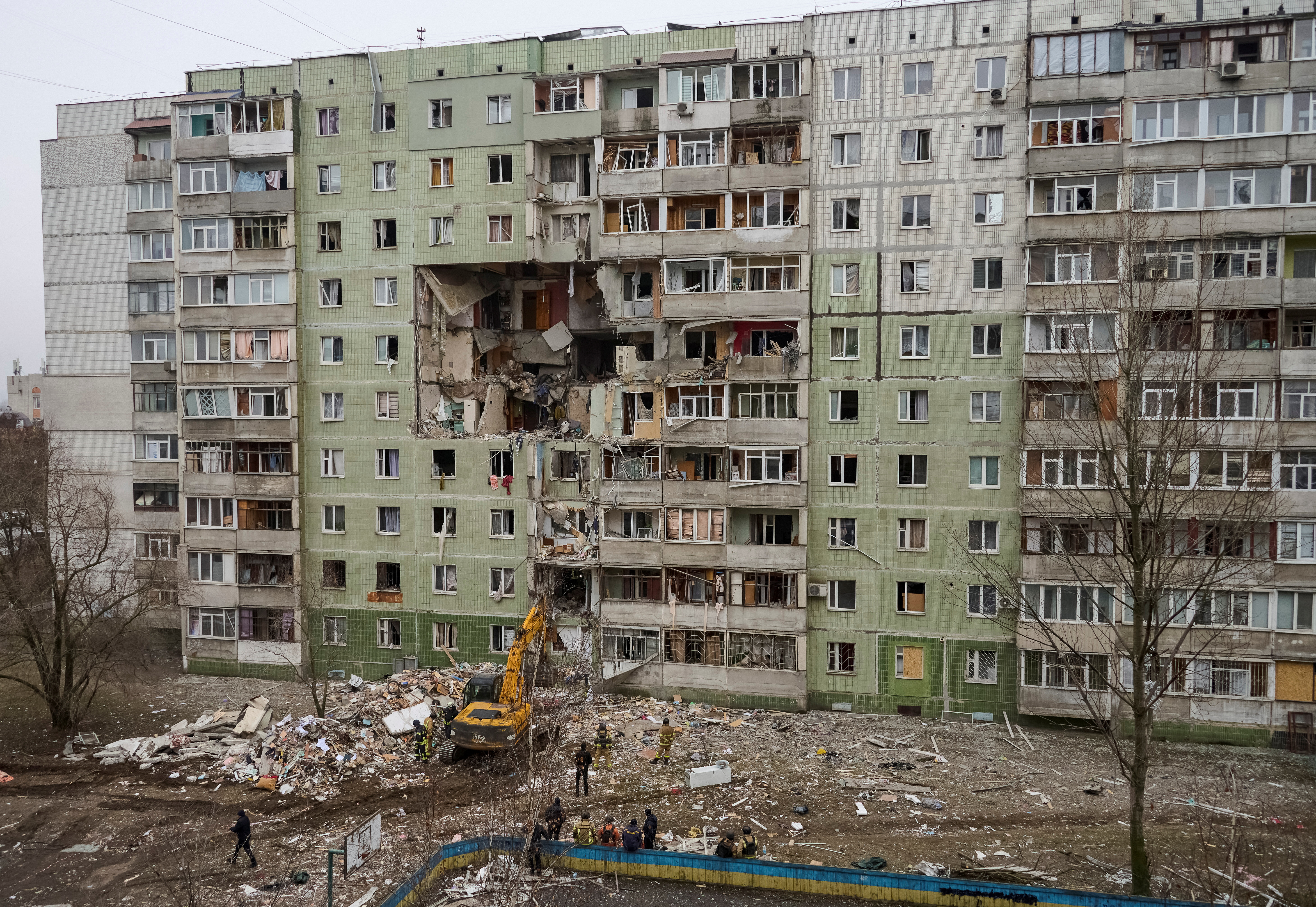 image Russian drone strikes apartment block in Ukraine, killing nine, Zelenskiy says