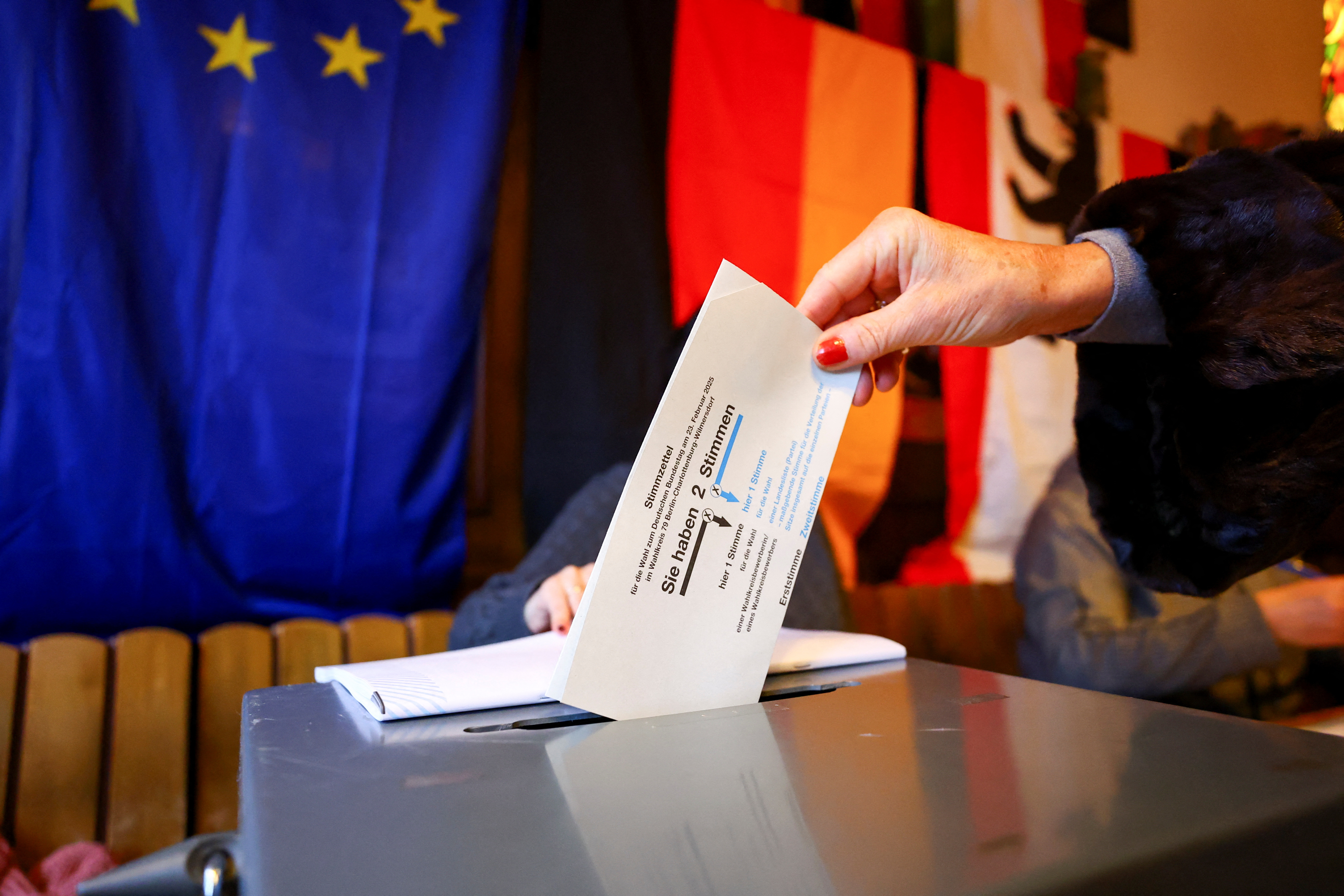 Germans start voting, polls suggest shift to right