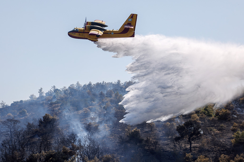 Wildfire rages outside Athens, residents urged to flee