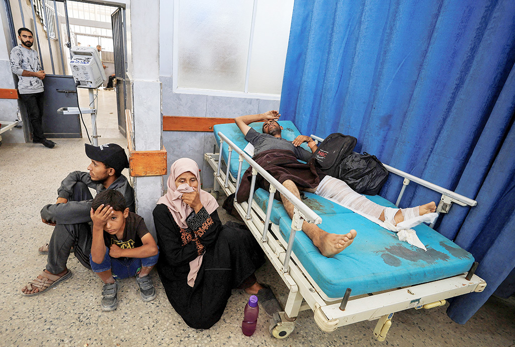 Israeli fire kills 30 in Gaza, medics say, as attention shifts to Iran