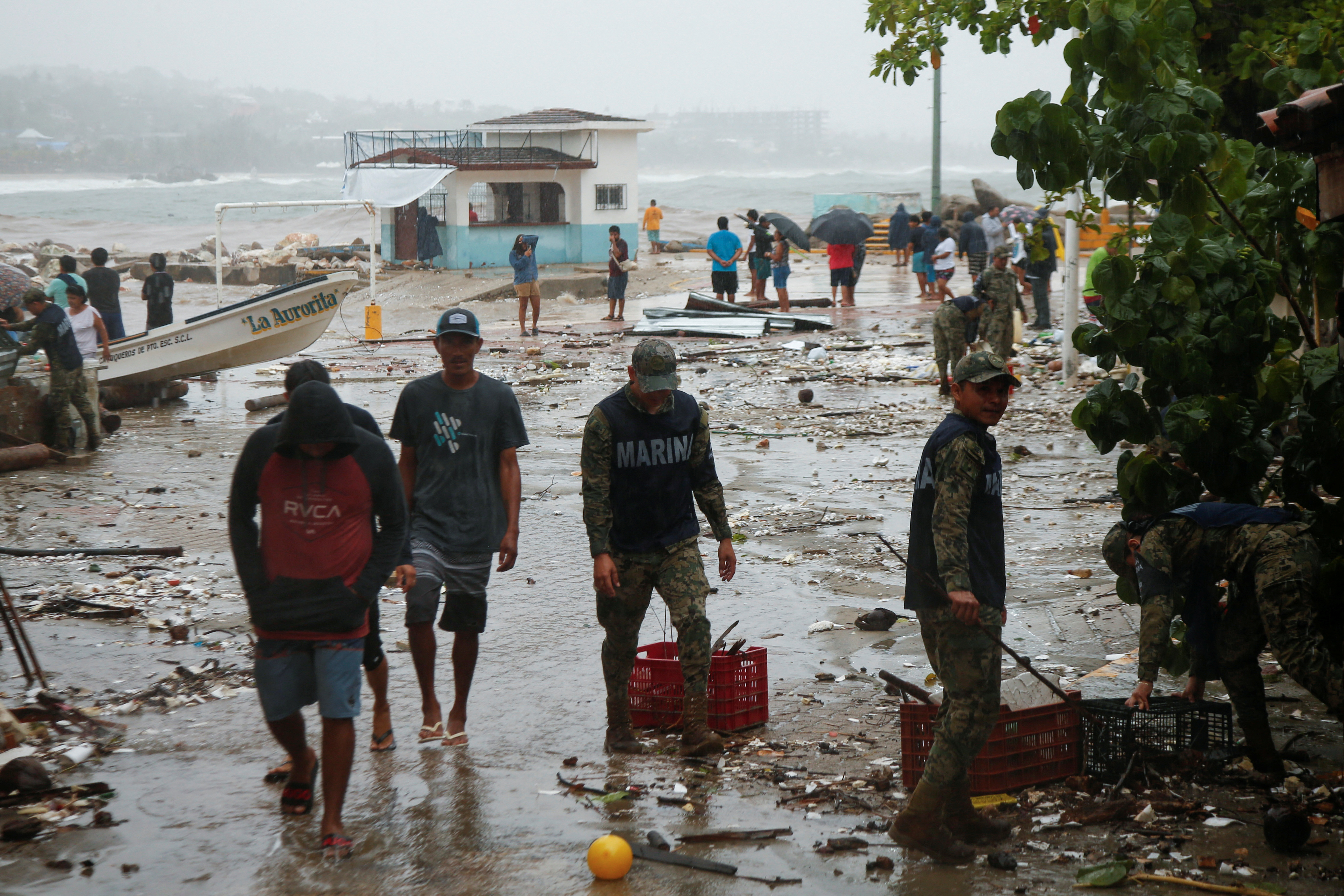 Hurricane Erick weakens over Mexico, leaving trail of damage in its wake