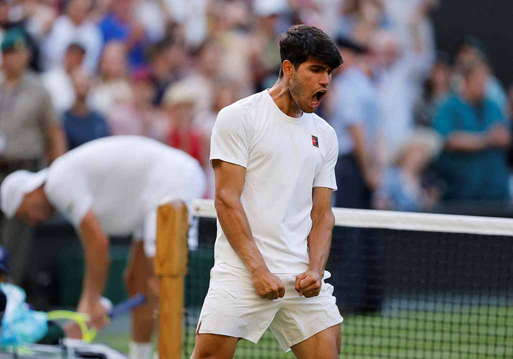 cover Alcaraz marches on at Wimbledon after tough test, Keys and Osaka crash out