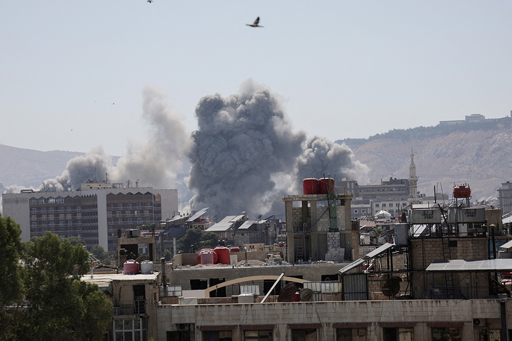 cover Israel launches heavy airstrikes in Damascus, vowing to shield Druze