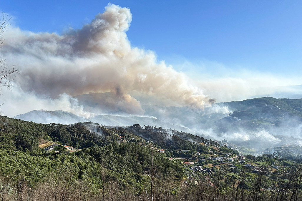 cover Portugal battles three large wildfires in sweltering summer heat