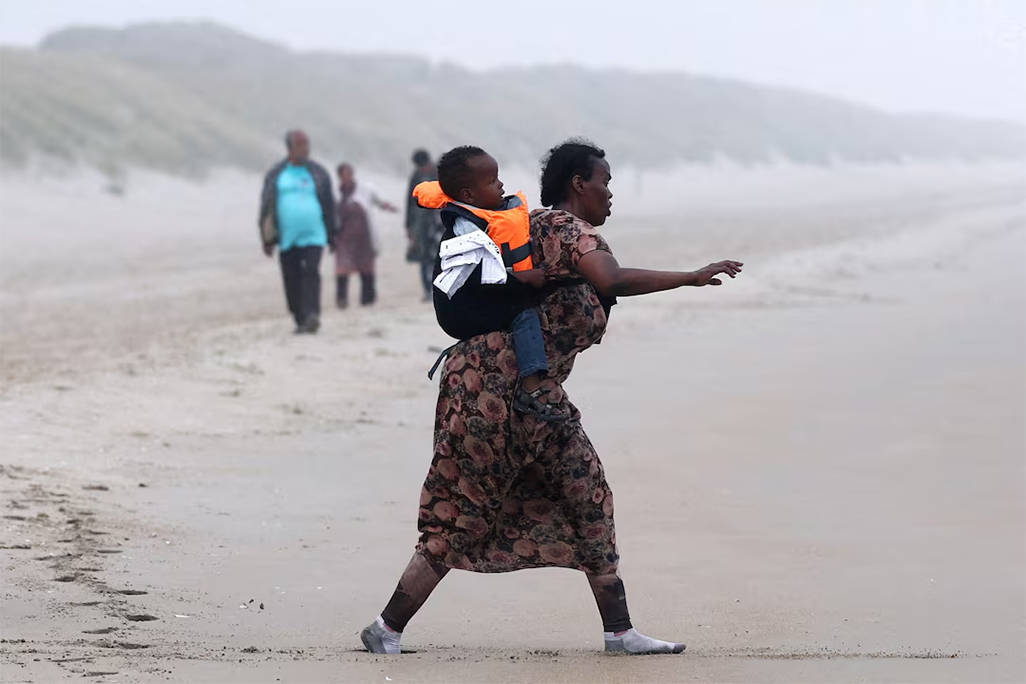 cover France and Britain hope migrant &#8216;taxi boat&#8217; plan will slow record Channel crossings