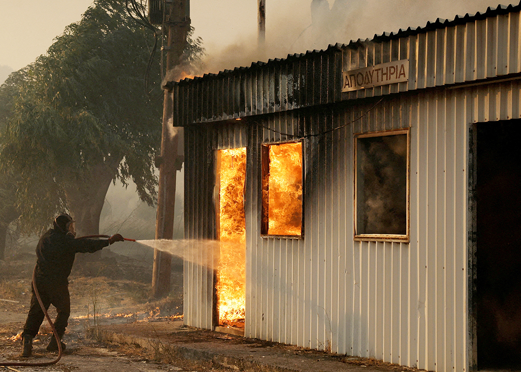 cover Wildfires fanned by heatwave rage across Europe