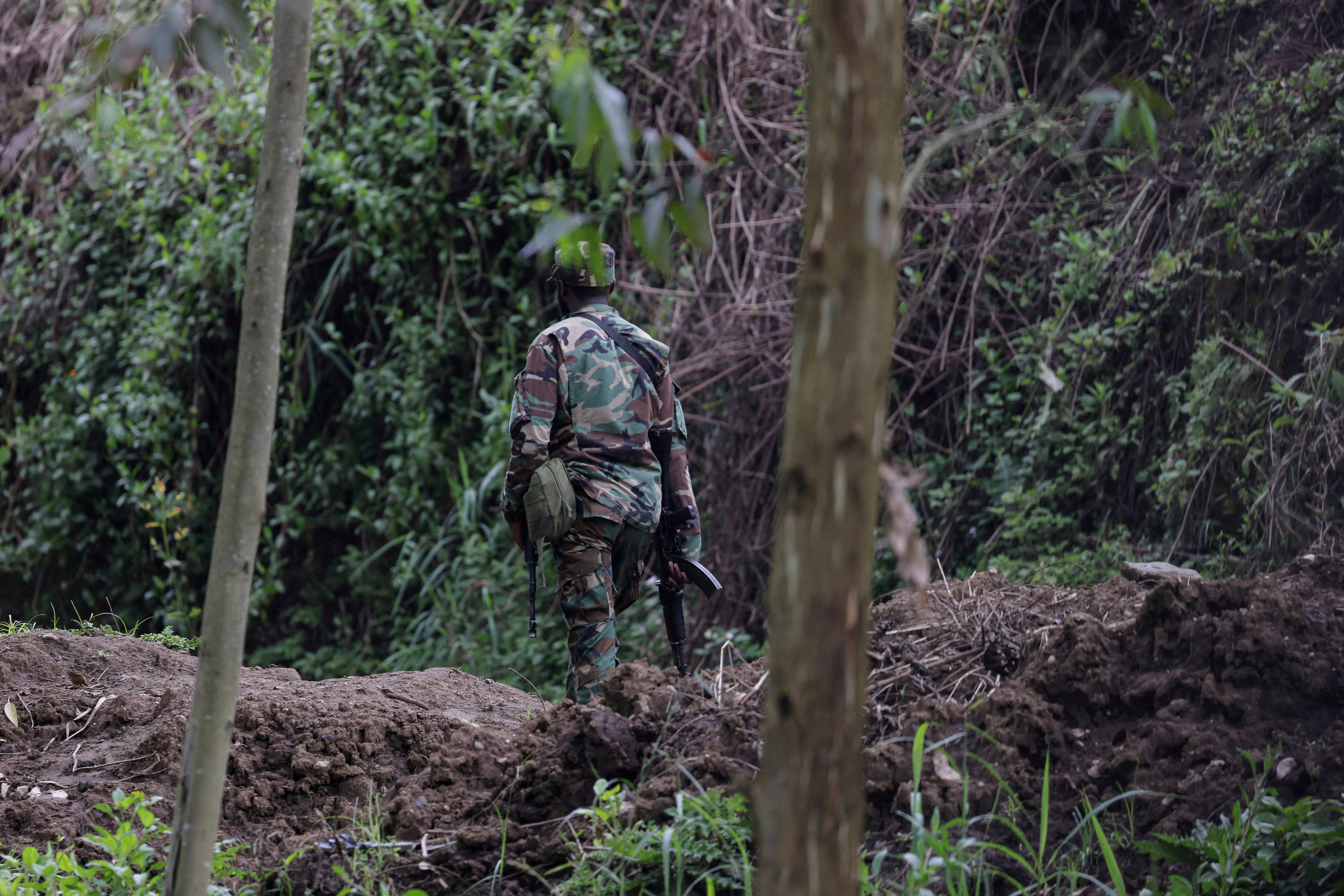 cover Rwanda rejects accusations allied rebels in Congo massacred civilians