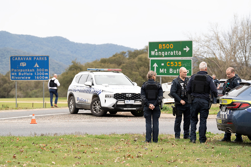 cover Australian police hunt gunman who shot dead two officers in rural town
