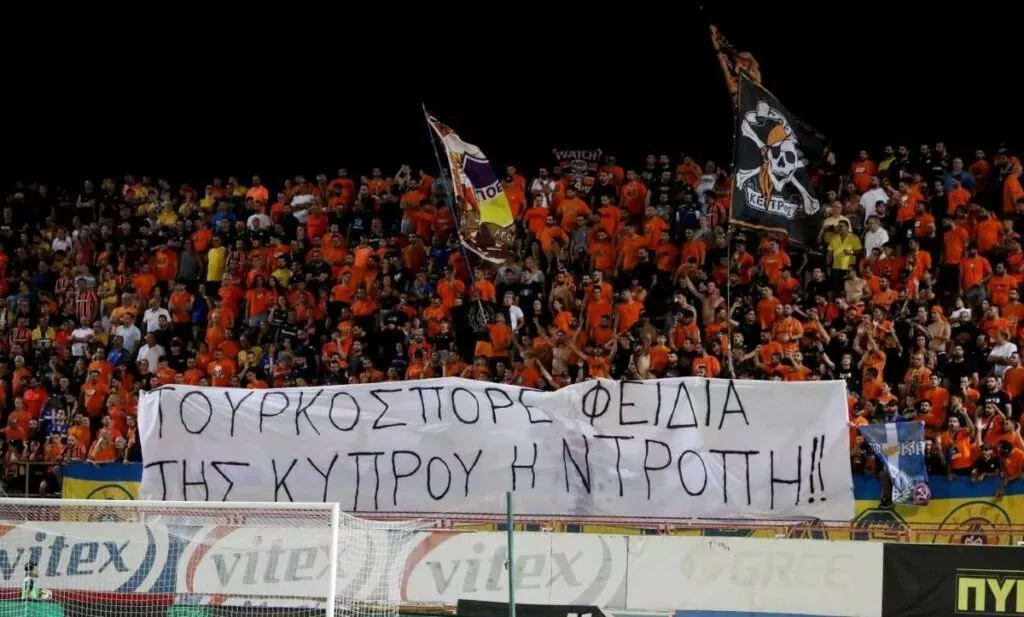 cover Man charged over banner at football match