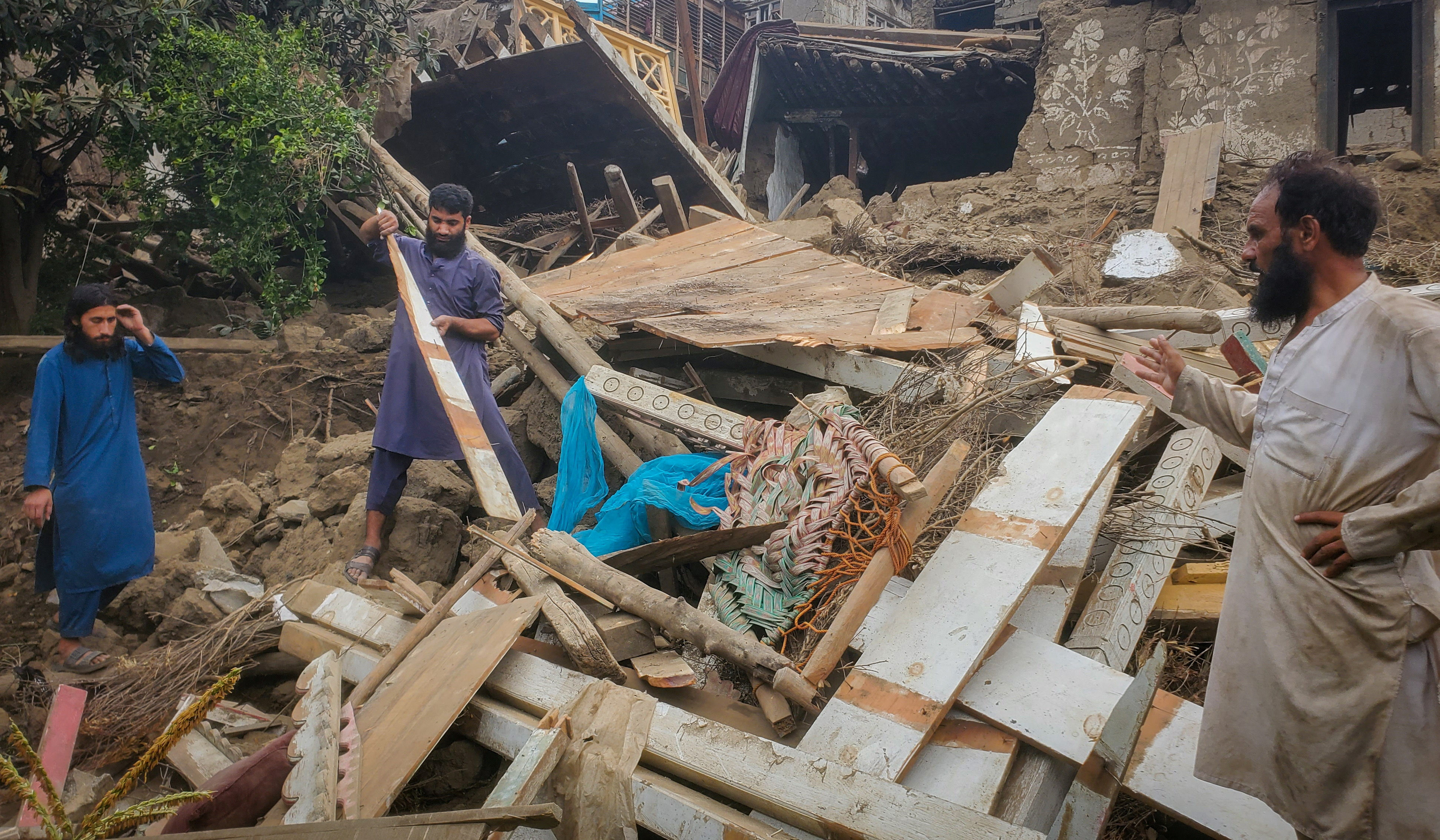 cover Rescuers in Afghanistan race to reach remote quake-hit mountain villages