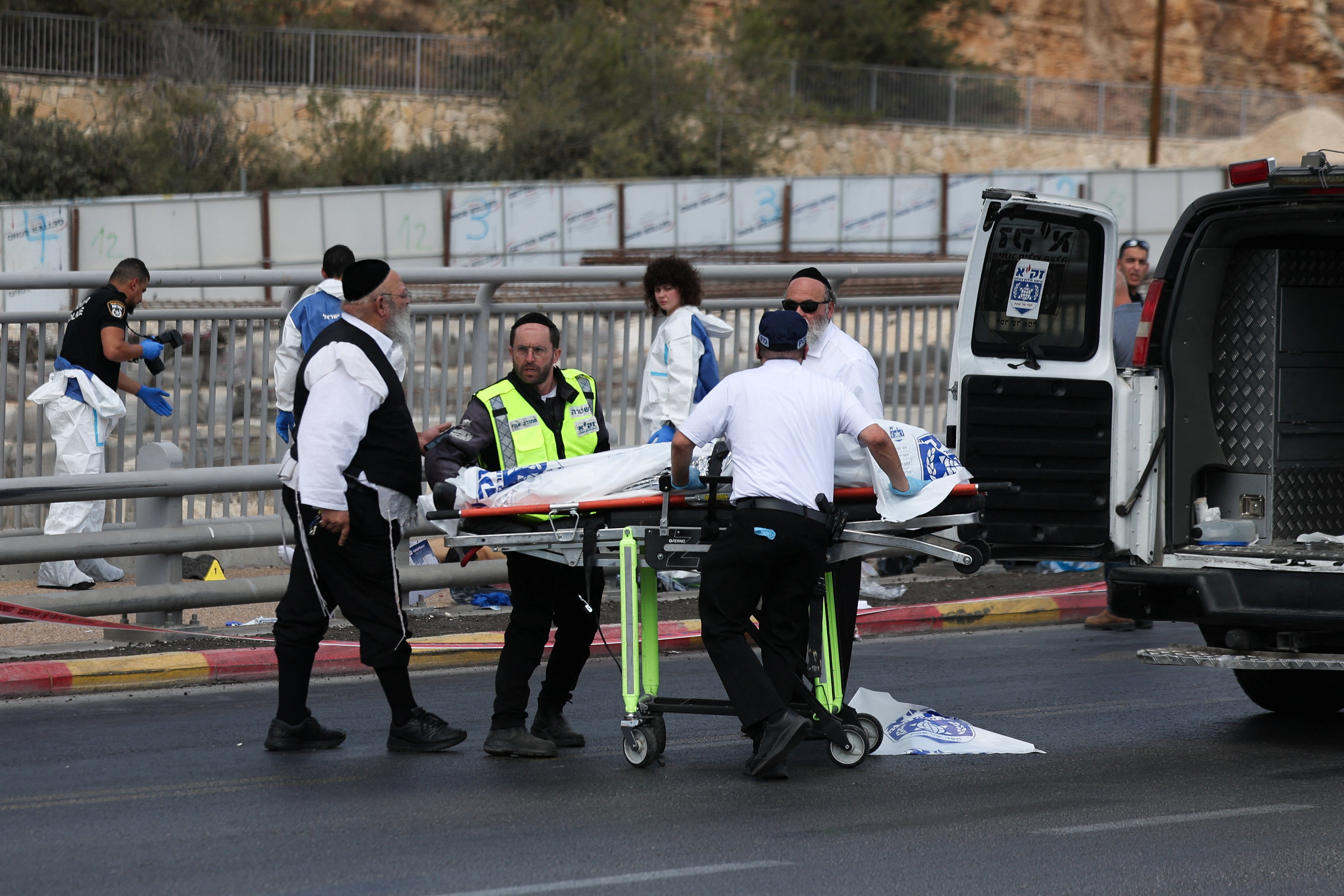 cover Four killed in Jerusalem shooting, perpetrators shot dead
