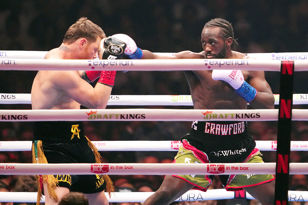 cover Crawford conquers Alvarez to make boxing history