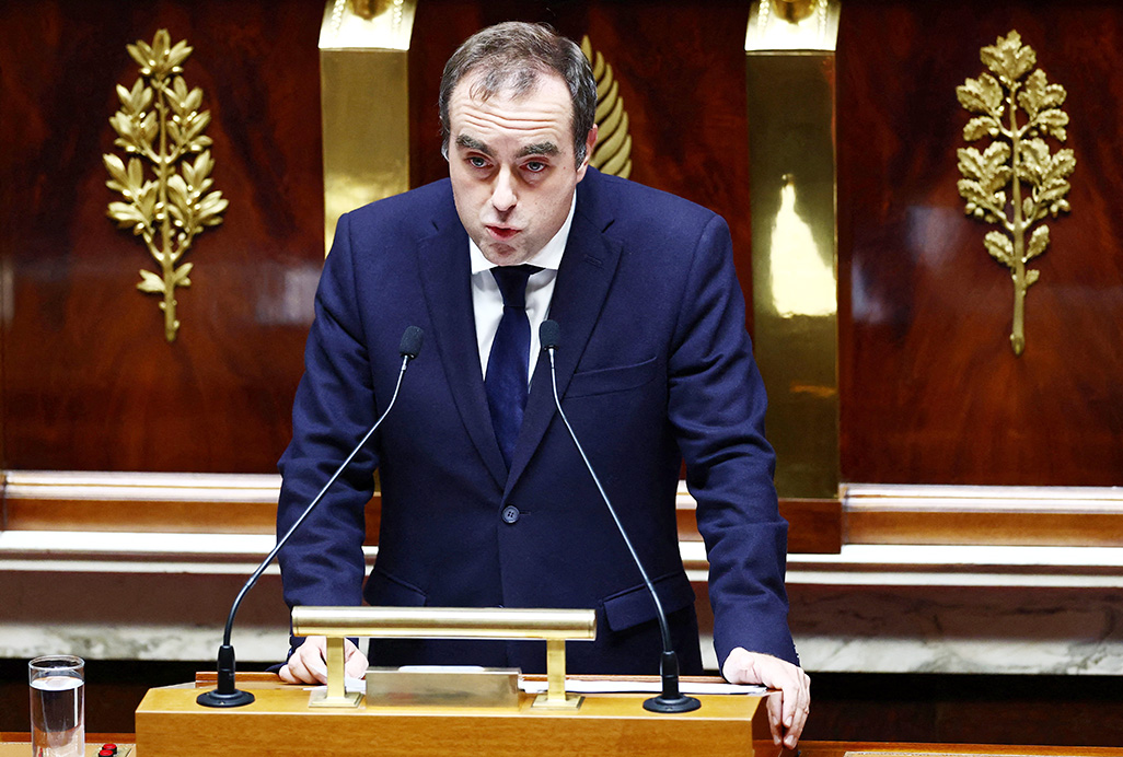 cover French PM suspends Macron&#8217;s flagship pension reform in search of support for budget