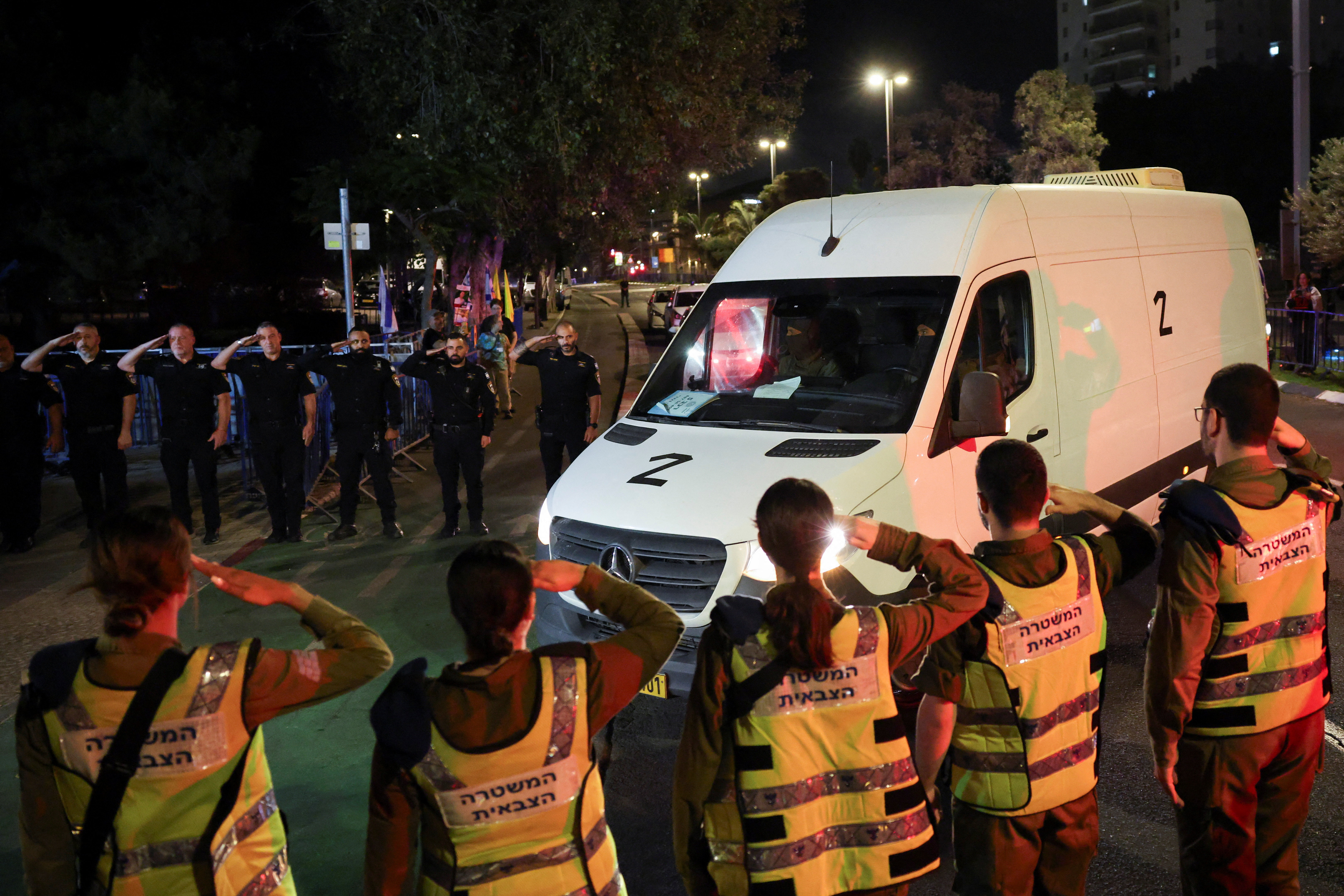 cover Hamas hands over hostage bodies after Israel threatens aid cut