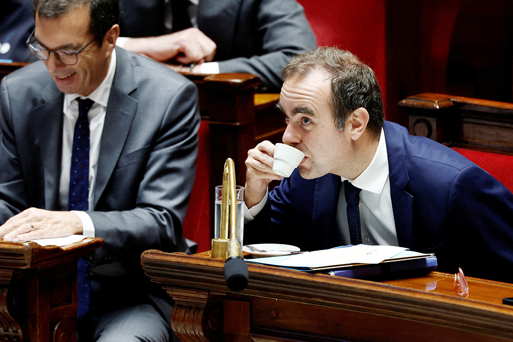 cover French PM survives no-confidence votes after making pension concession