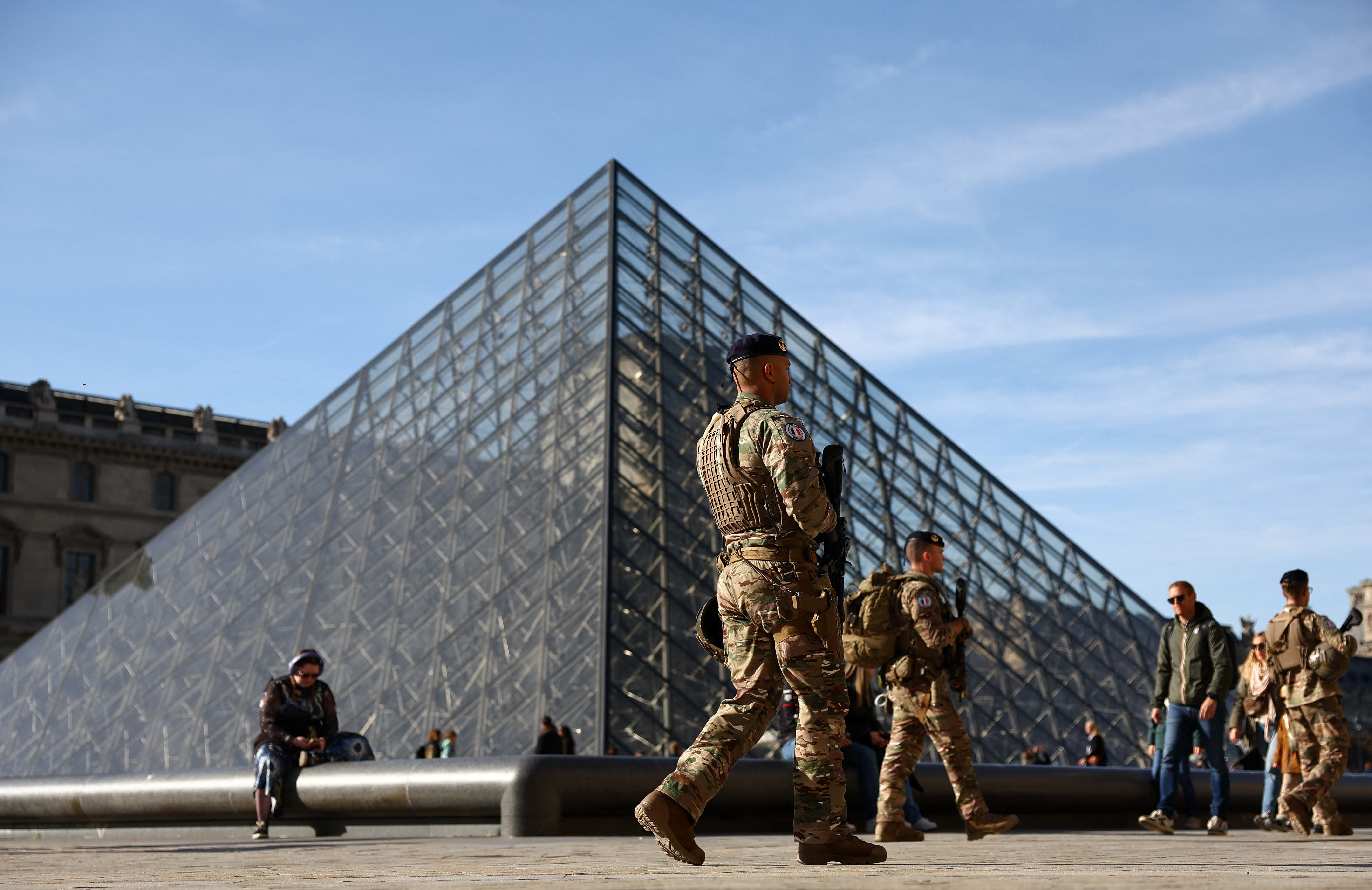 cover French police hunting stolen Louvre jewels arrest more suspects