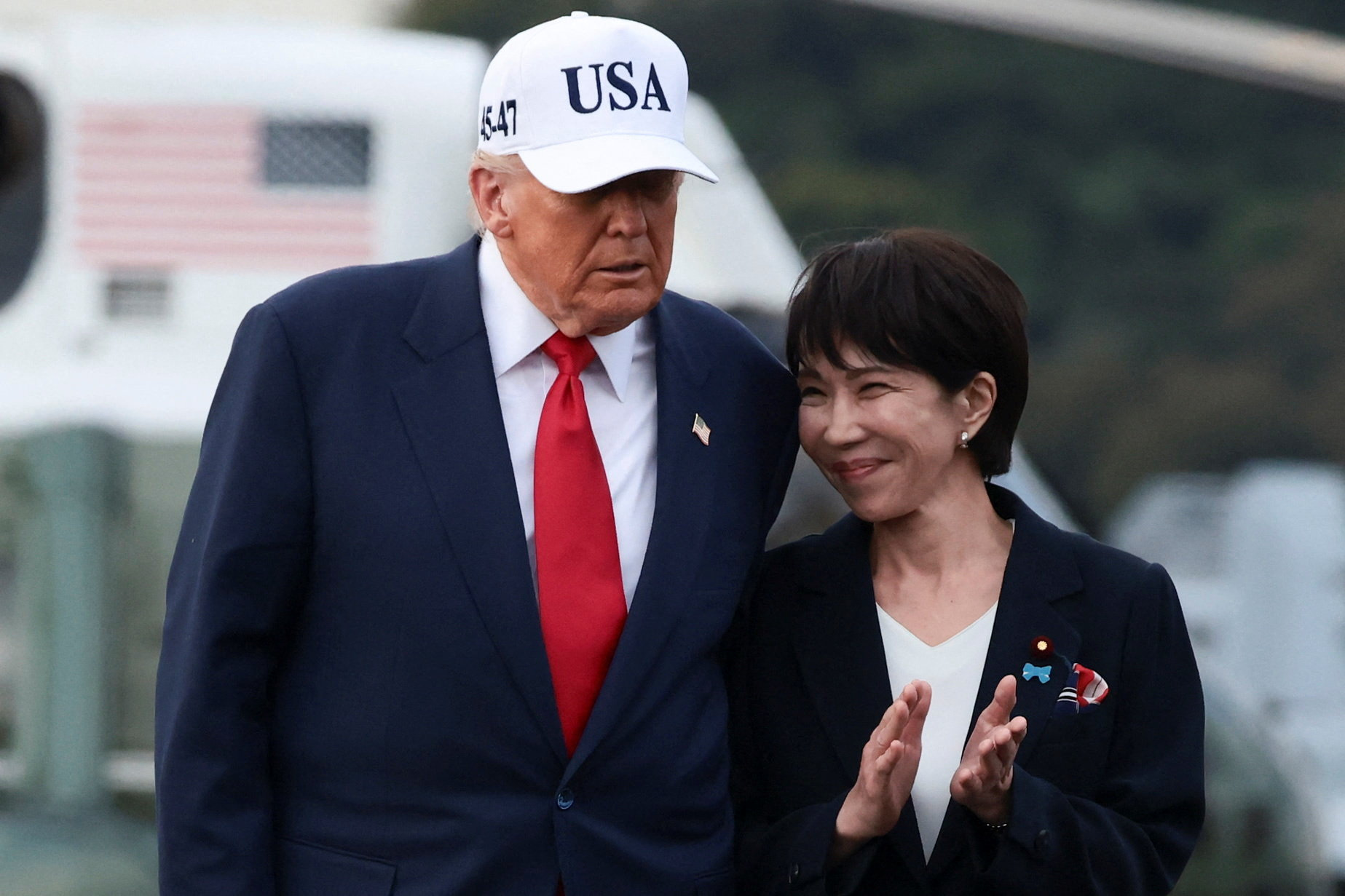 cover Trump heaps praise on Japan’s first female leader, signs rare earths deal