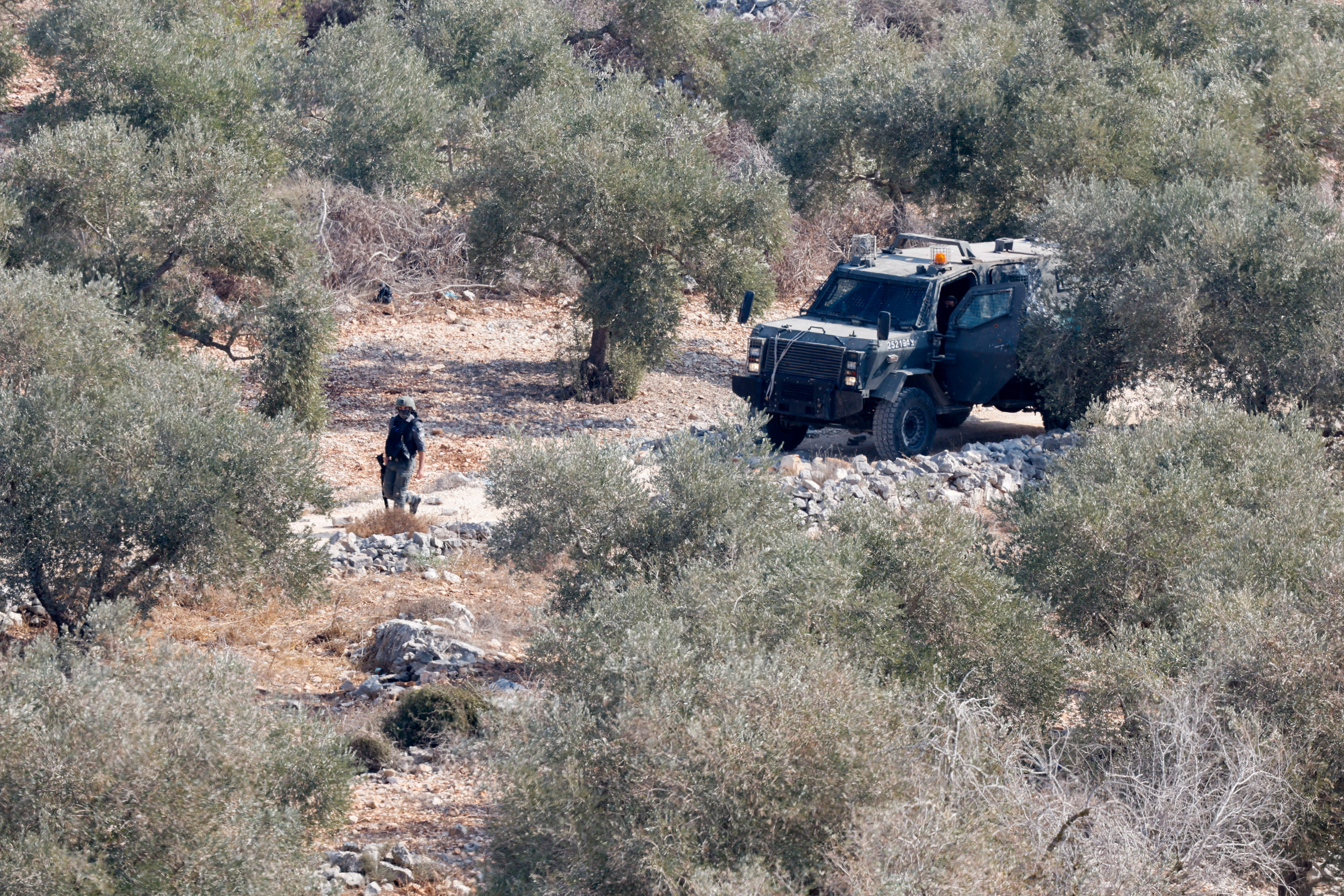 cover Masked Israeli settlers torch property, injure four Palestinians, army says