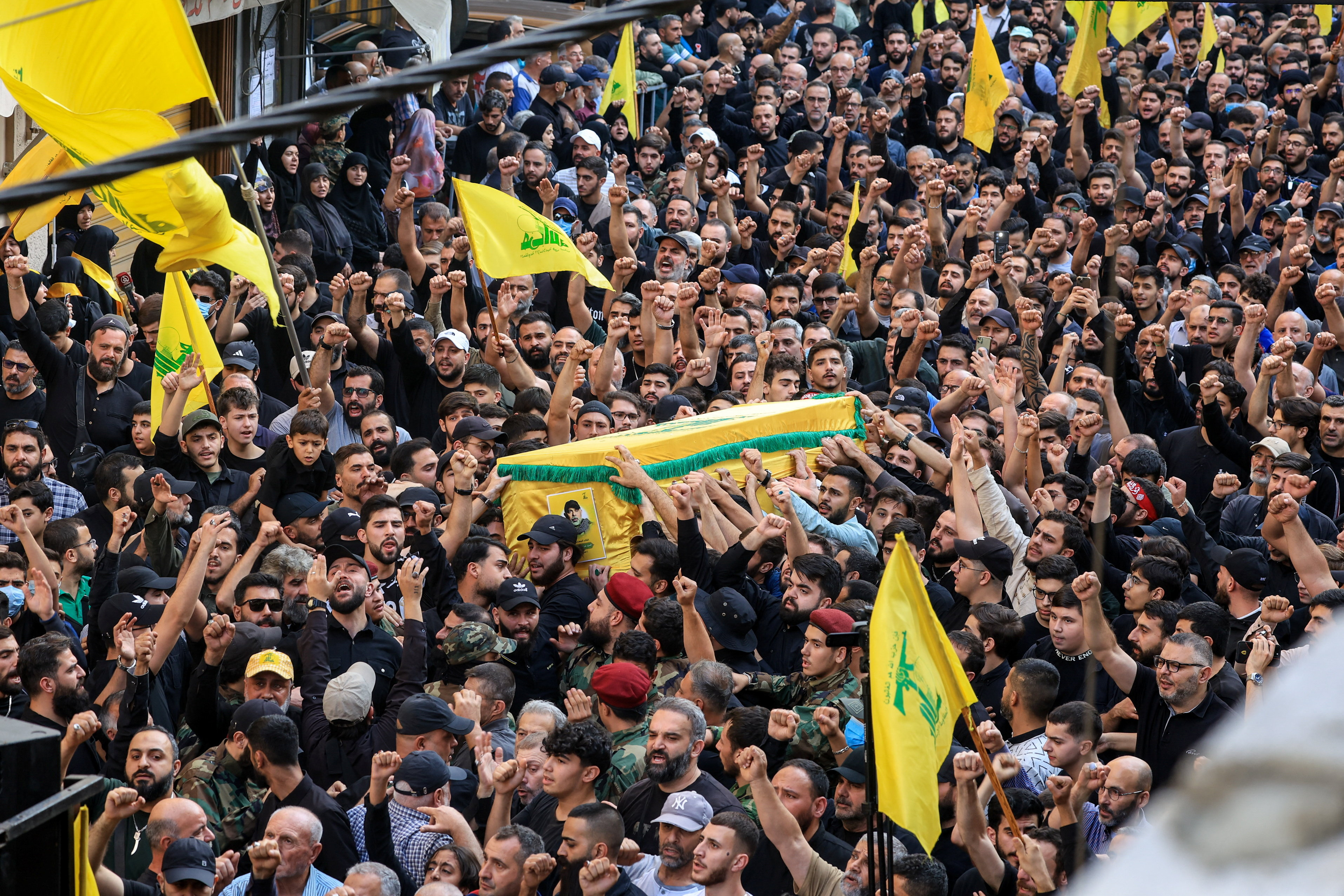 cover Crowds in Beirut suburbs mourn Hezbollah commander slain by Israel