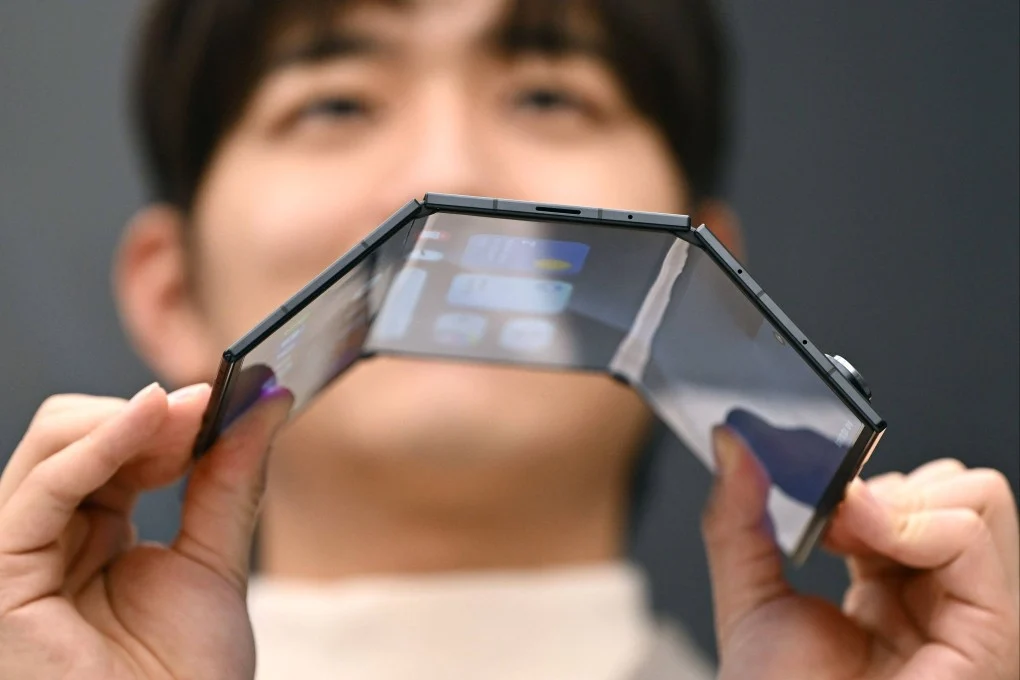cover Samsung unveils first multi-folding phone as competition set to heat up