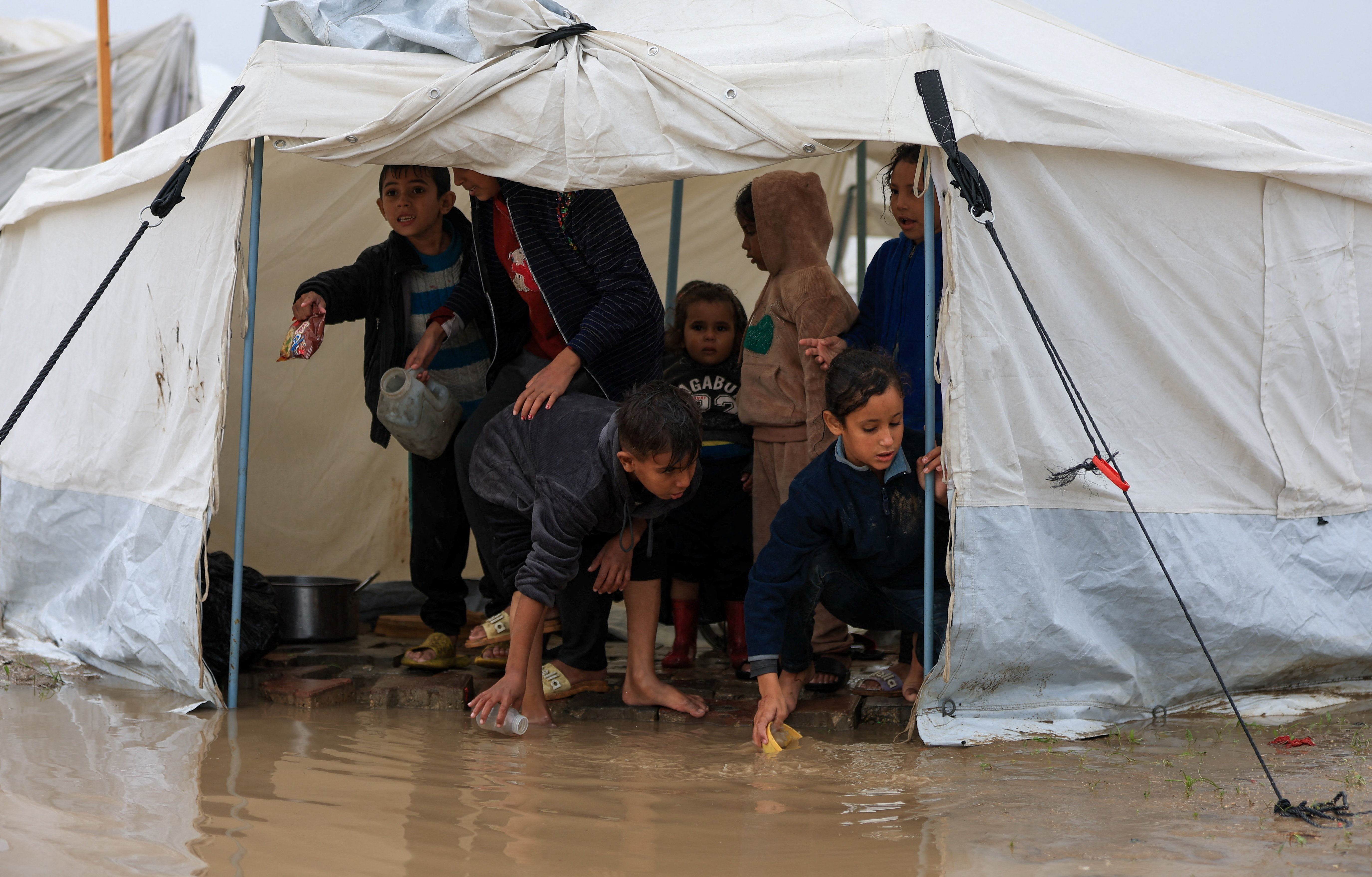 Torrential rain flooded Gaza tents and a baby died of exposure, medics say