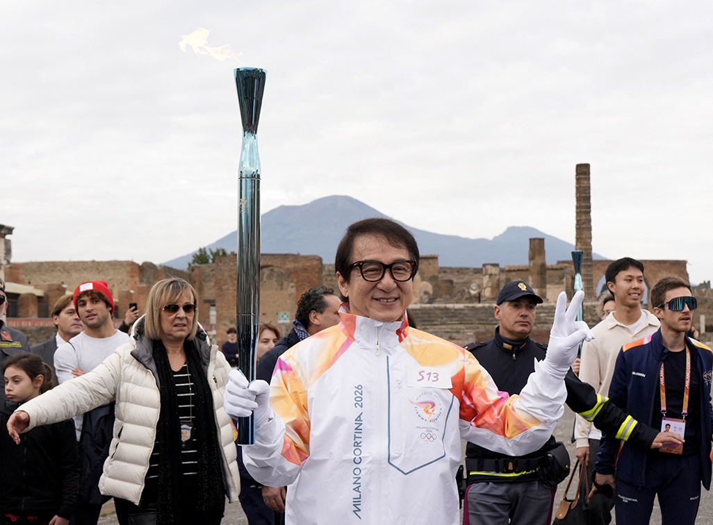 cover Olympic Flame reaches Bologna one month before Winter Games