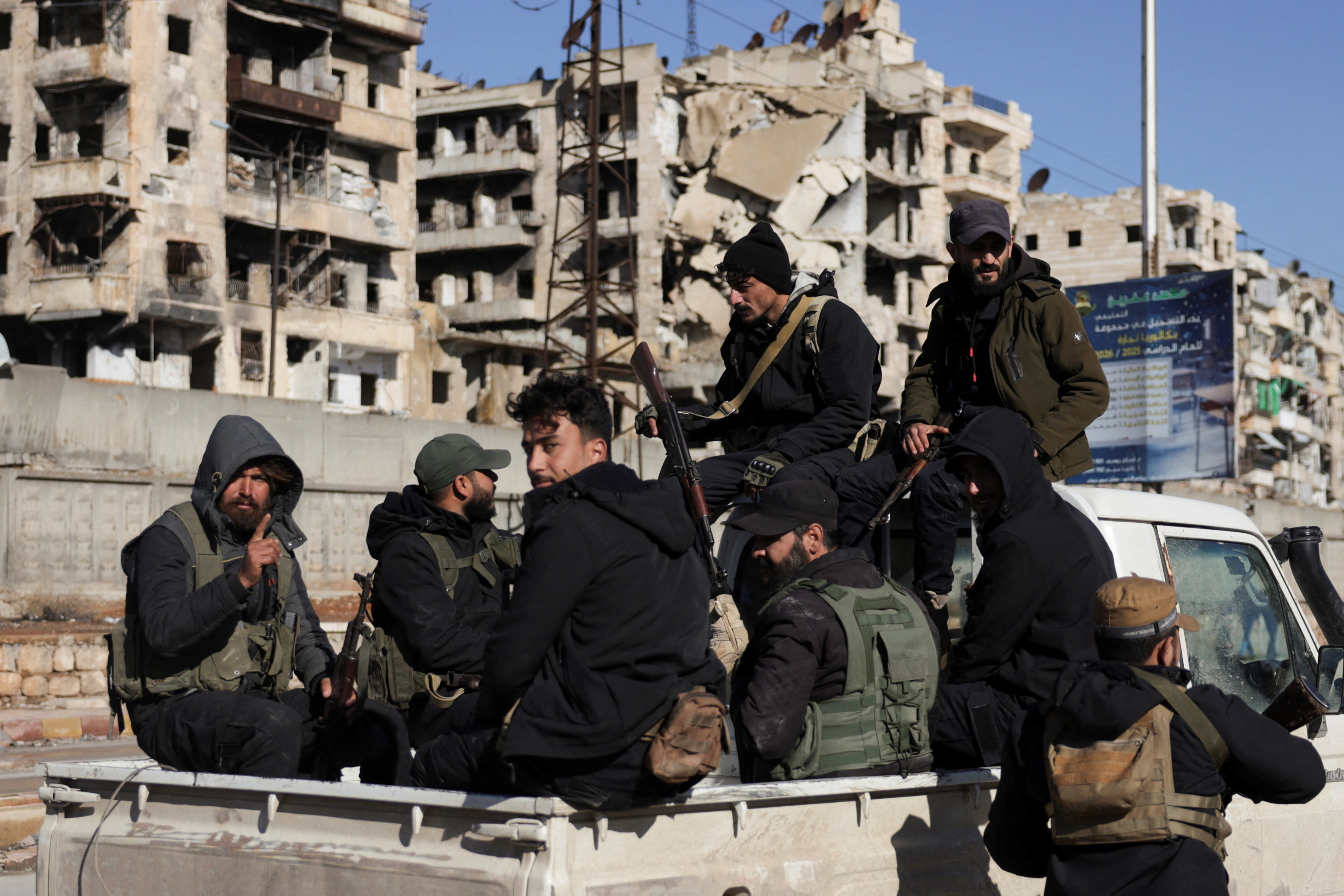 cover Syrian army says has cleared last Kurdish-held area in Aleppo, Kurdish forces deny takeover