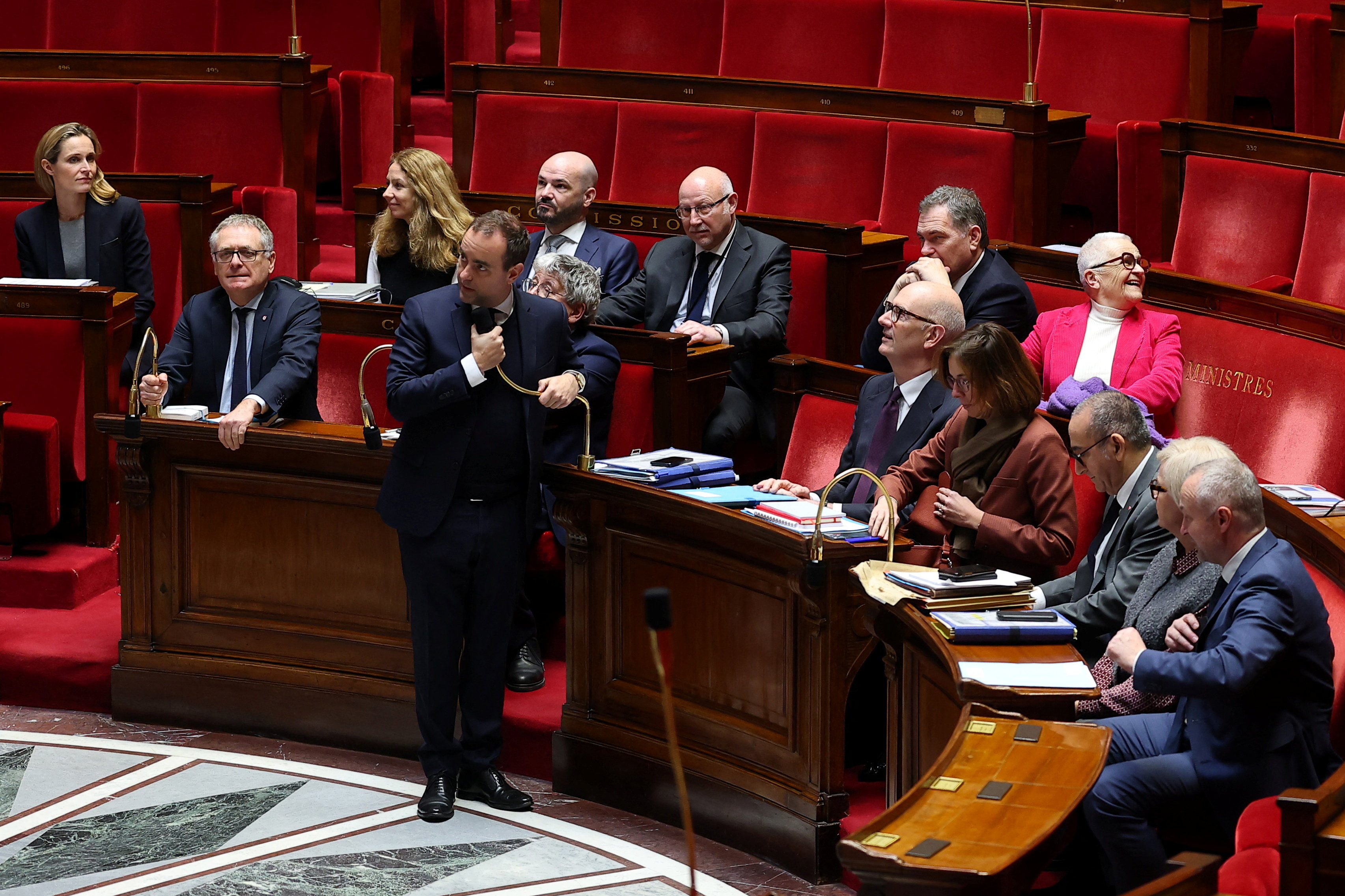 cover French government survives no-confidence votes over budget