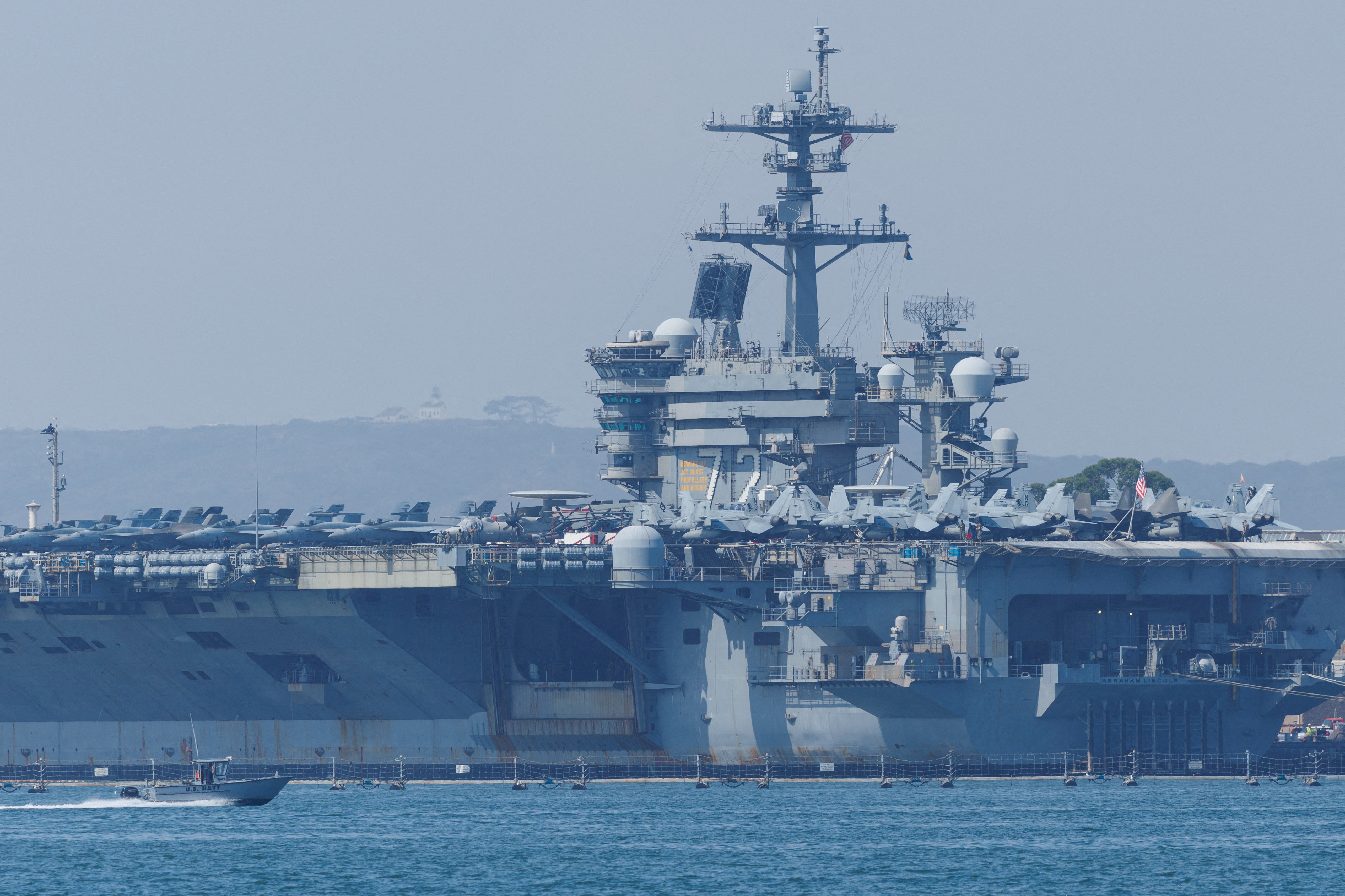 cover US shoots down Iranian drone approaching aircraft carrier, official says